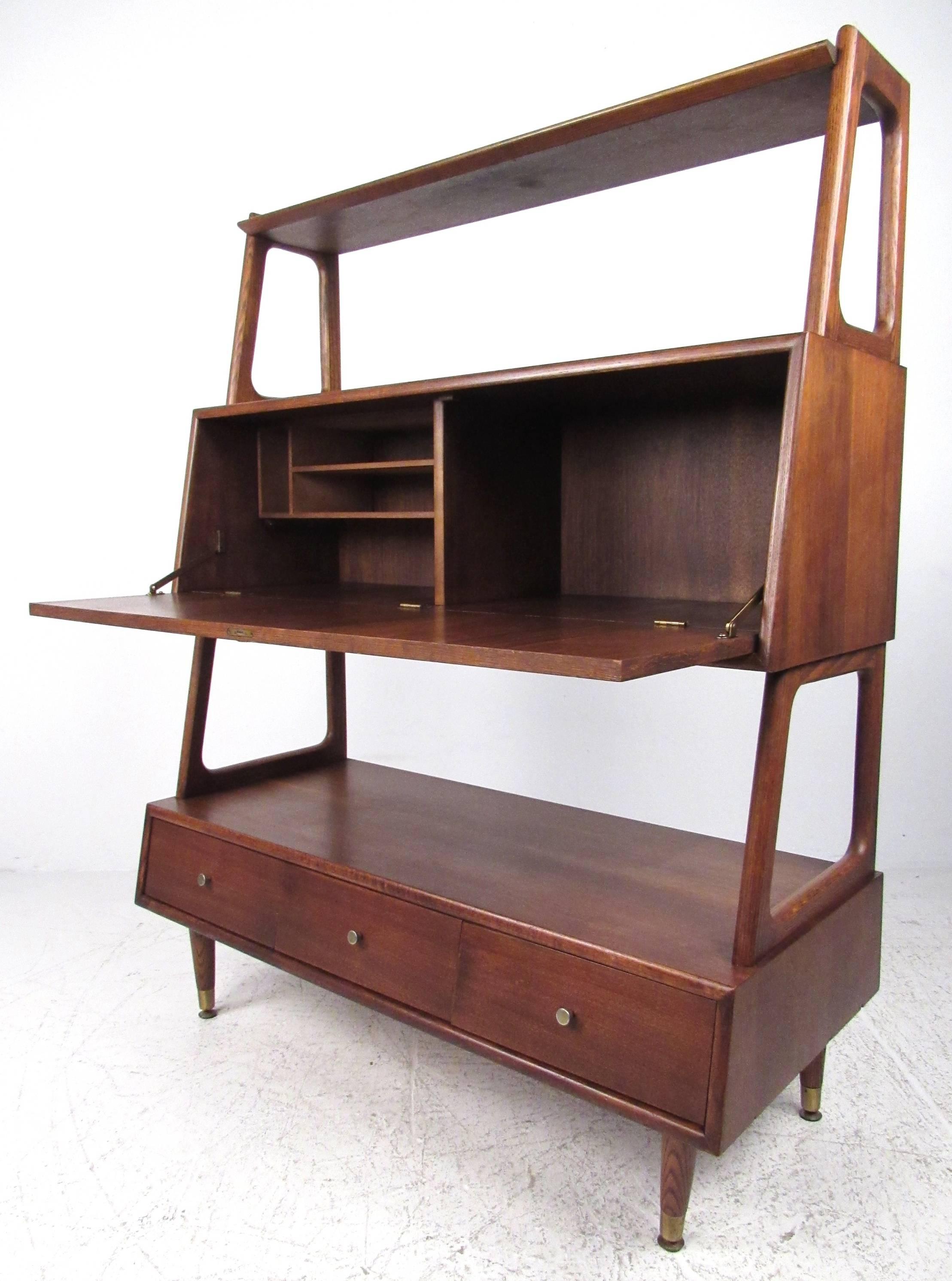 Unique combination drop front desk unit with three-tier bookshelf and three storage drawers at base. Walnut and oak construction with brass hardware. Please confirm item location. Second similar unit also available, contact for details. 