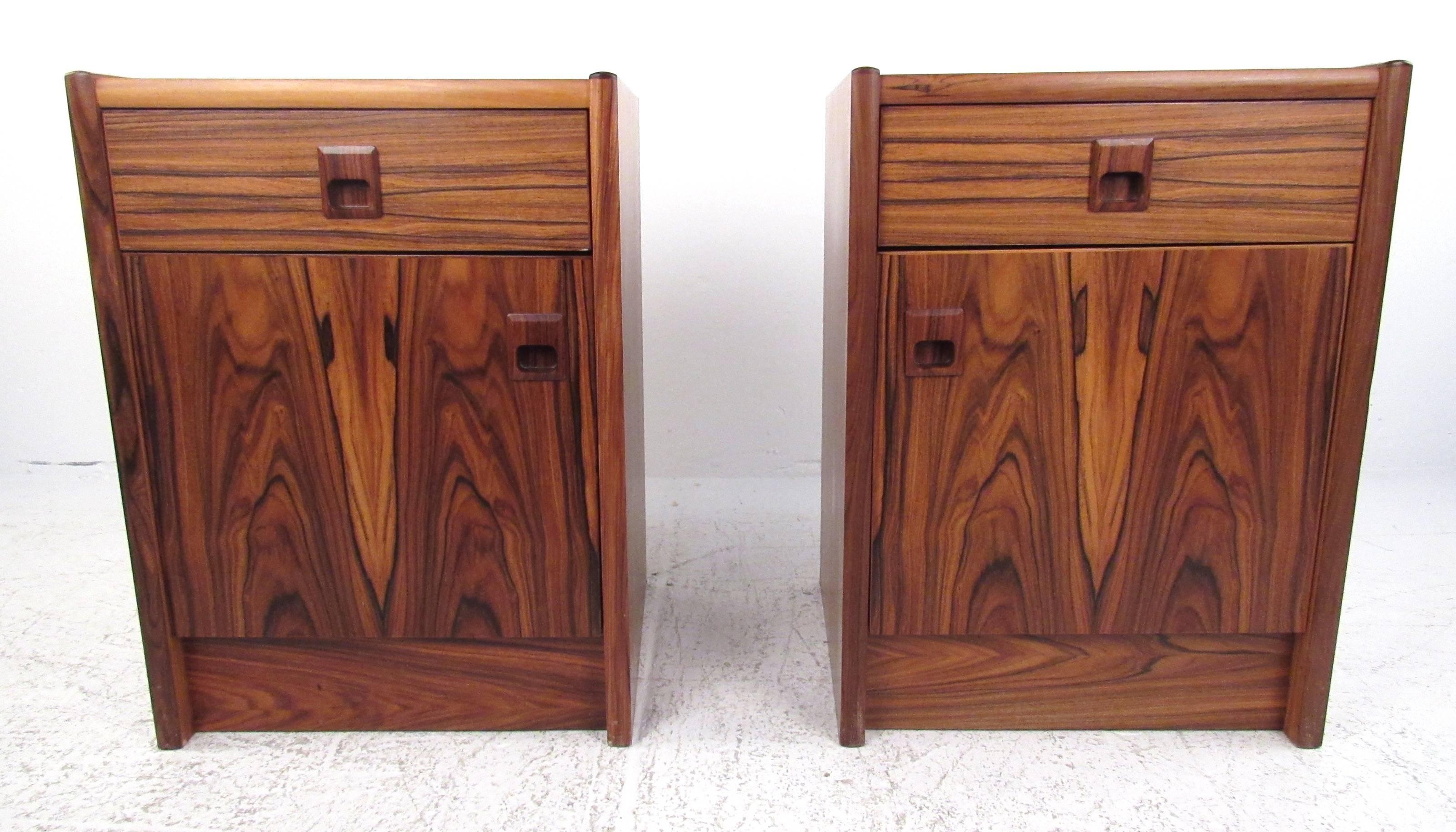 Pair of single drawer rosewood nightstands with storage compartment below.