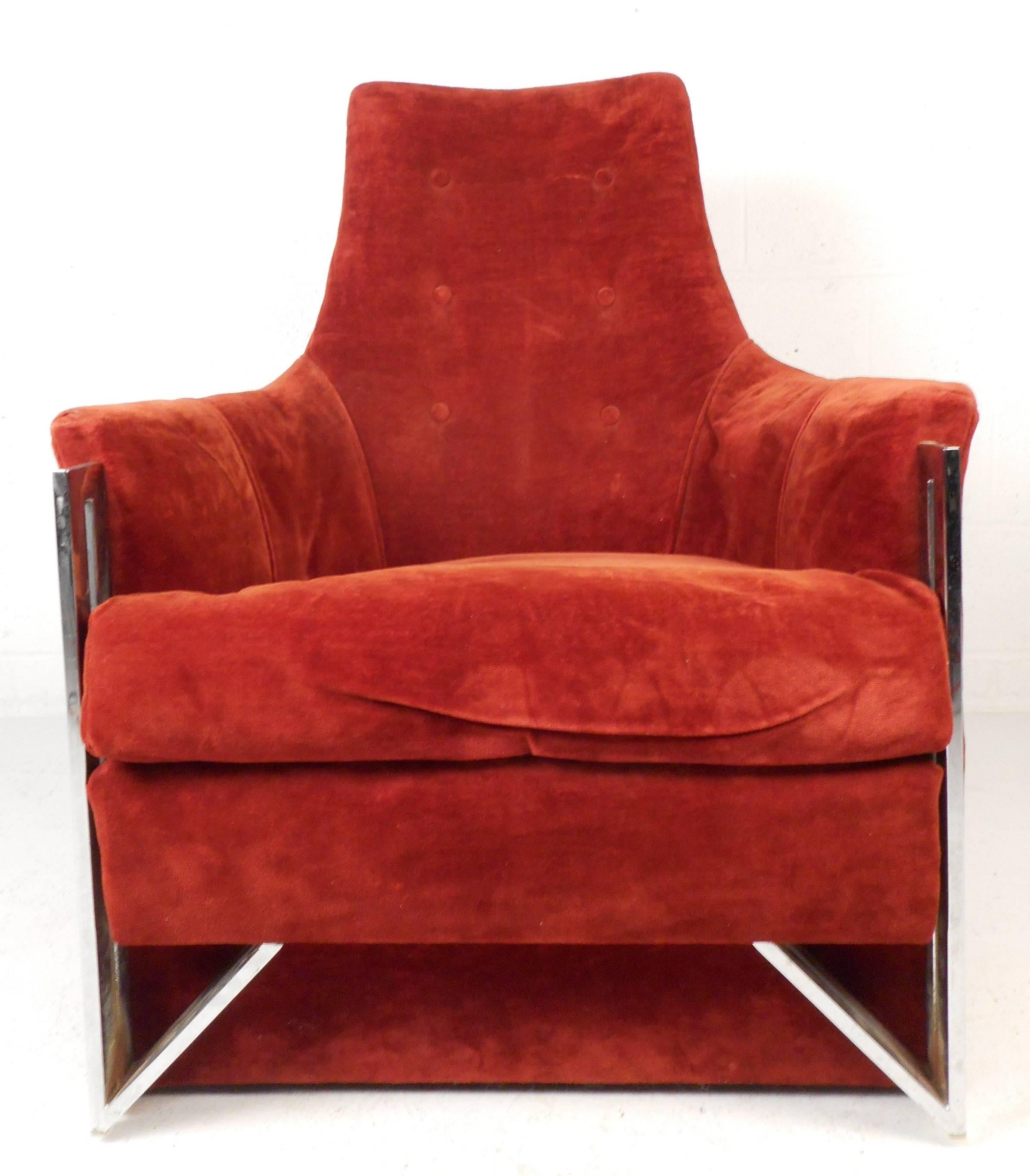 Impressive vintage modern lounge chair with a heavy sculpted chrome frame and a tufted backrest. Unique design features plush velvet upholstery, a very thick removable cushion, and large wraparound arm rests. This incredibly comfortable chair makes