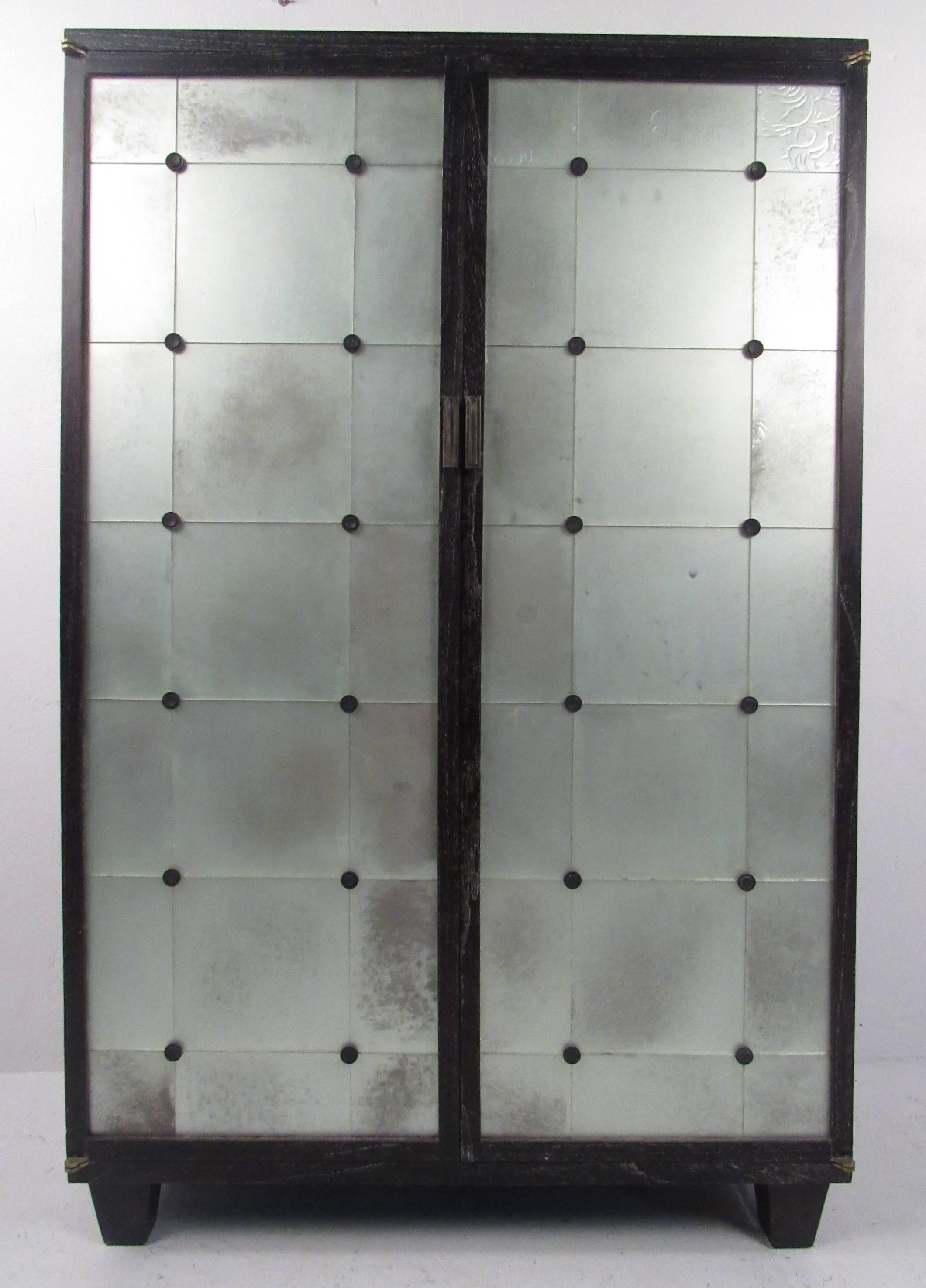 Unique frosted glass-front two-door cabinet with three internal shelves and ample space to house multiple electronic components. Please confirm item location (NY or NJ) with dealer.