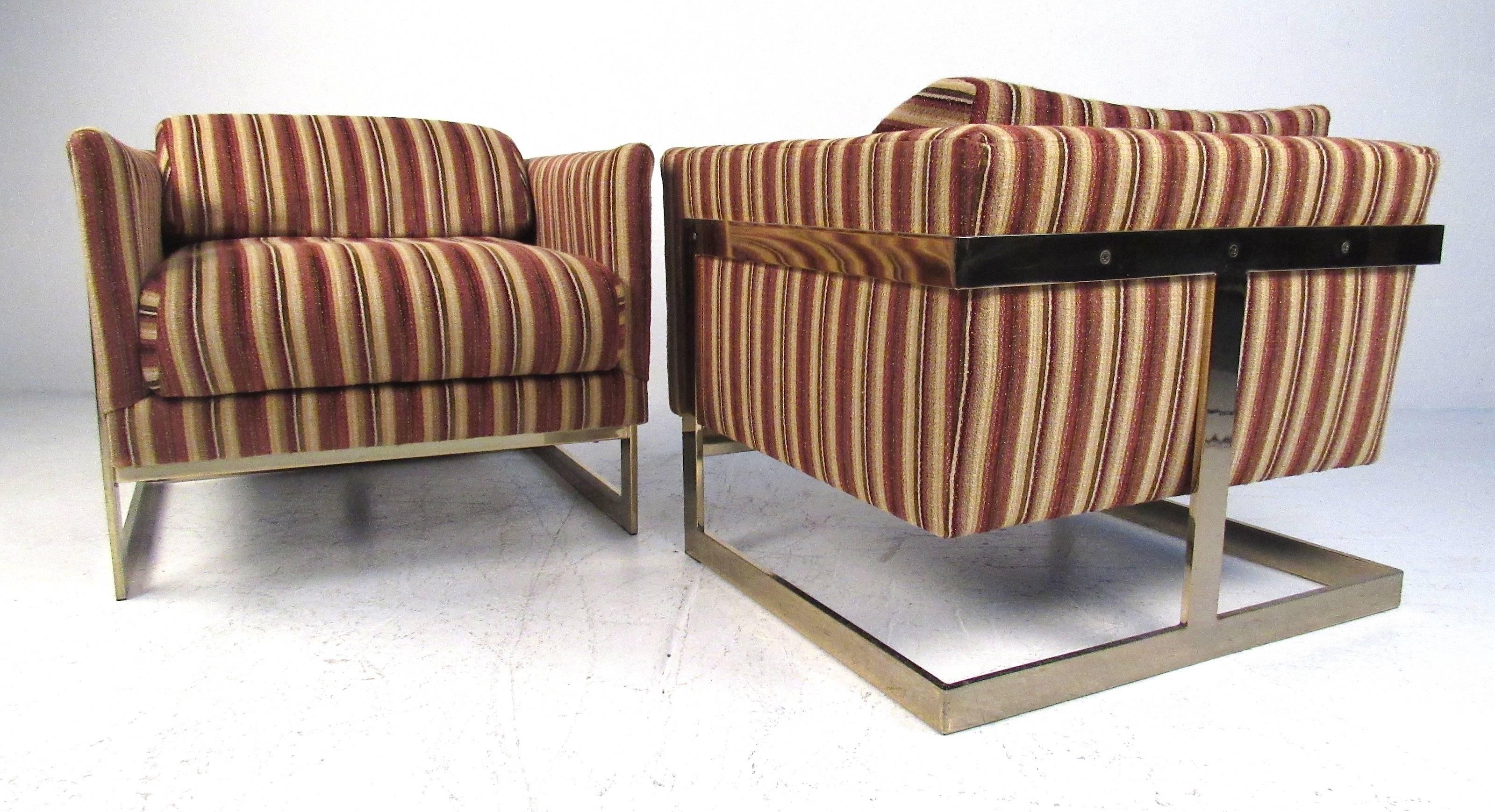 Pair of mid-century cantilevered lounge chairs with brass frames and bold striped upholstery by Milo Baughman for Thayer Coggin. Please confirm item location (NY or NJ) with dealer.