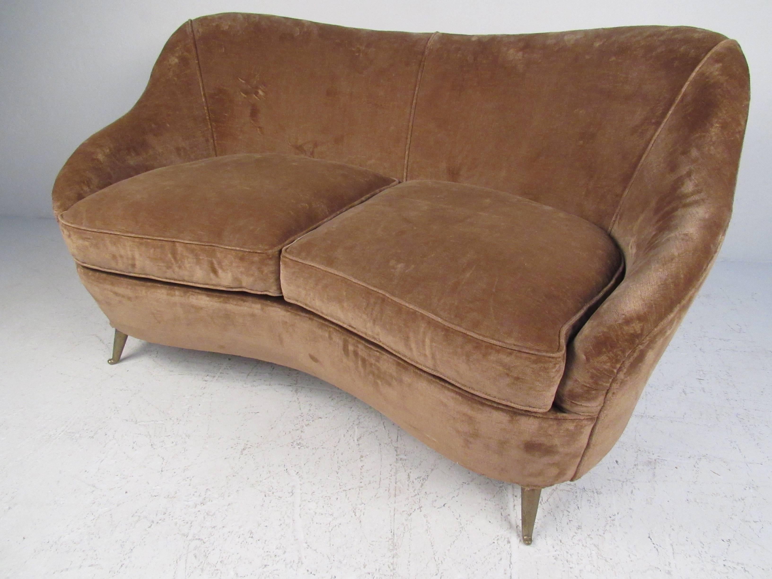 Comfortable sculptural sofa with high back, gently sloping arms and curved brass legs attributed by Gio Ponti. Please confirm item location (NY or NJ) with dealer.
 