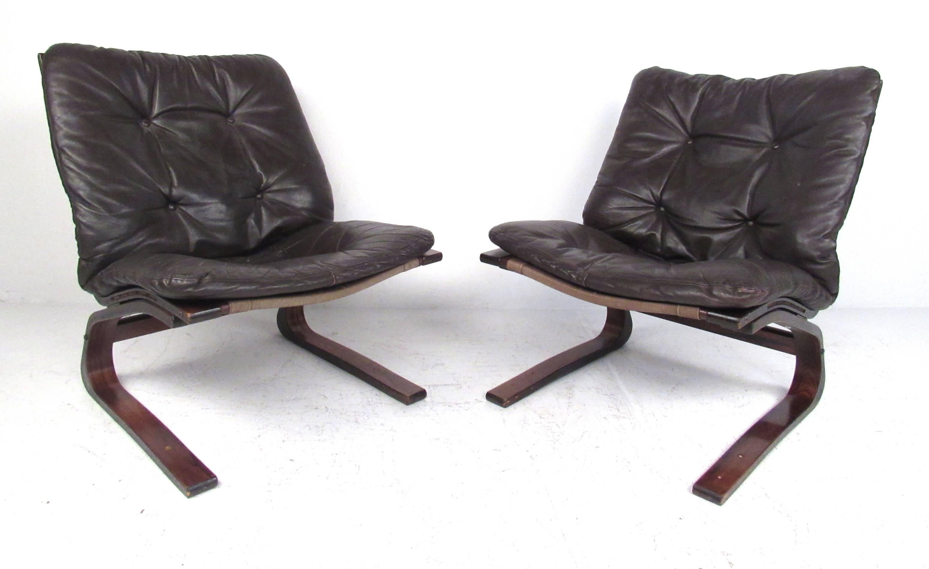 Danish modern Westnofa siesta chairs with bent plywood frames and deep brown leather upholstery. Please confirm item location (NY or NJ) with dealer.