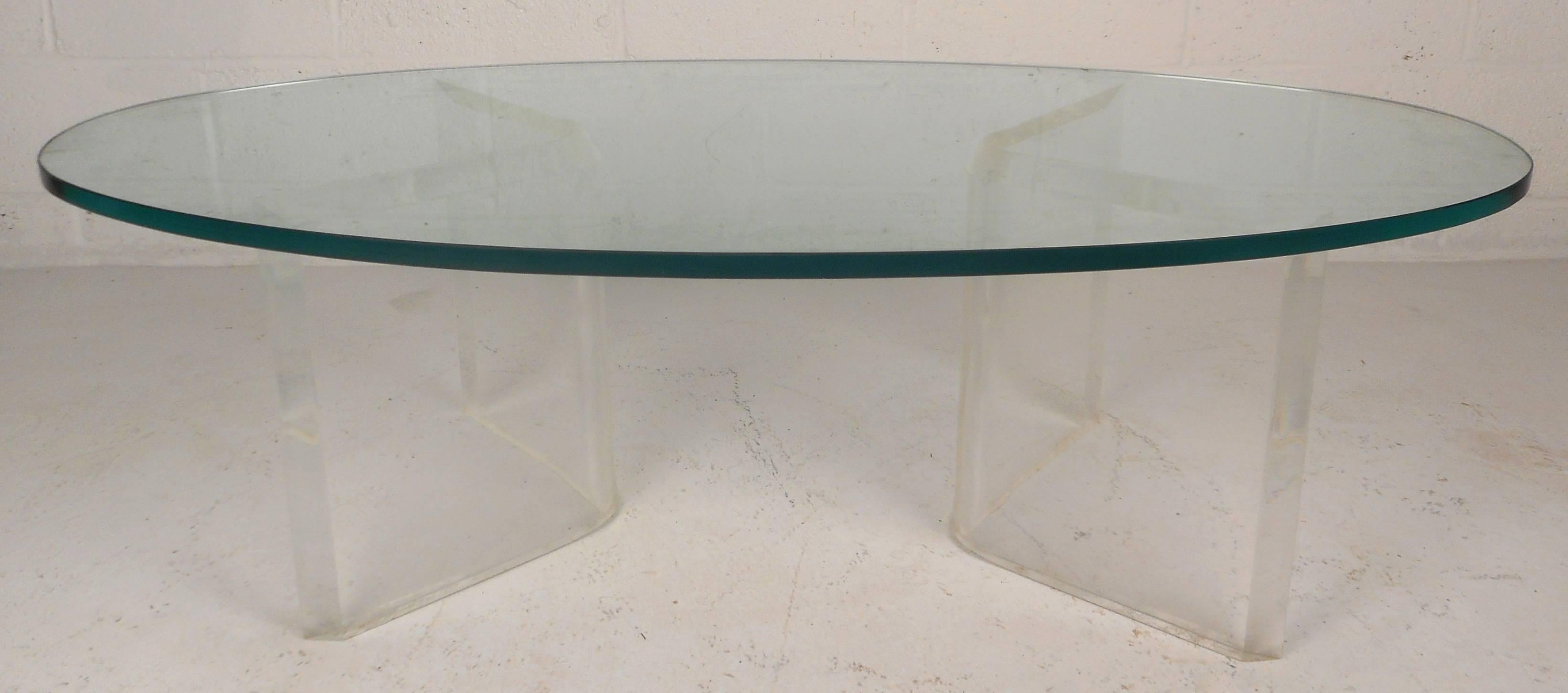 Beautiful vintage modern coffee table features a unique two-piece 