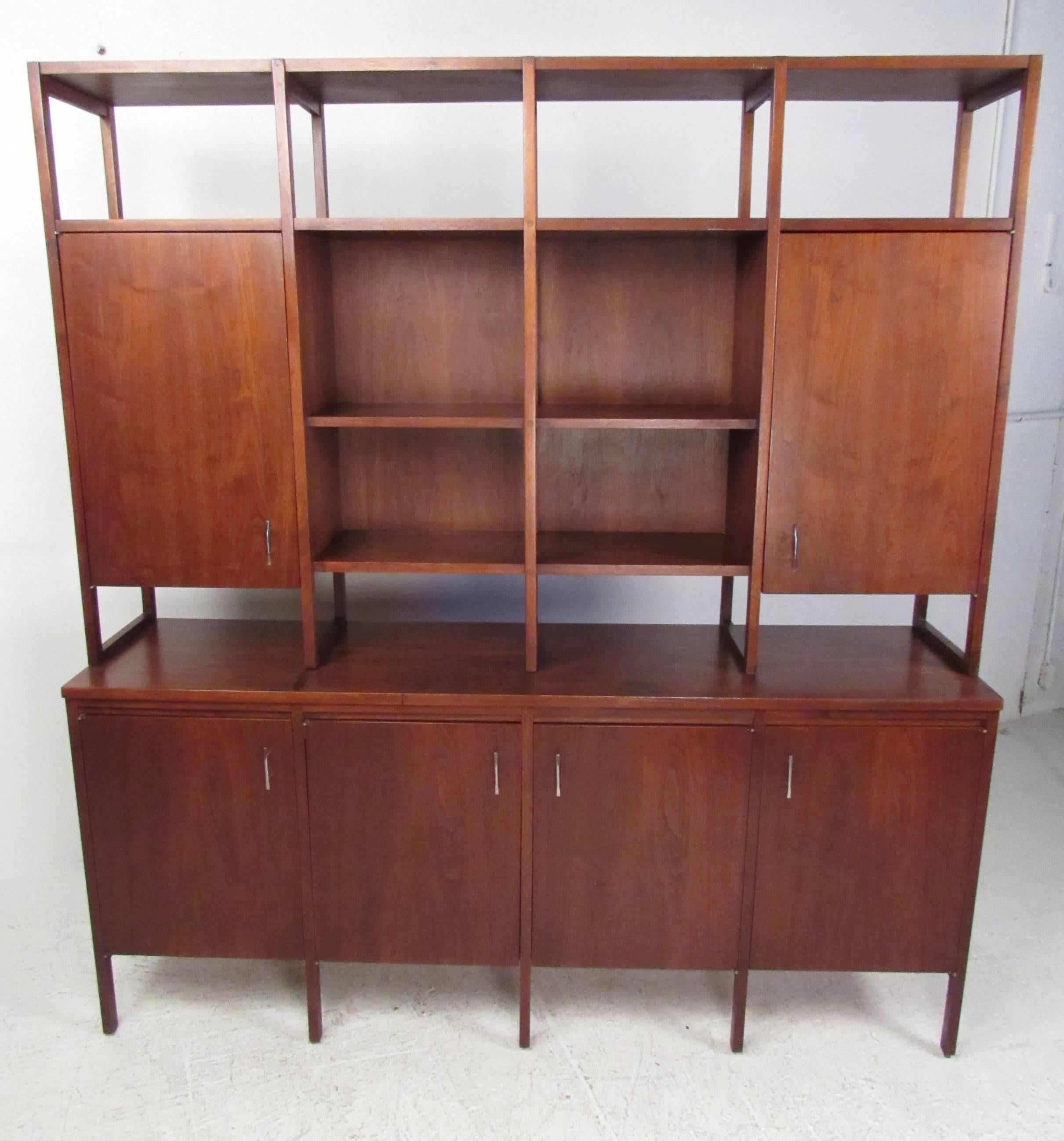 Very impressive two-piece walnut wall unit designed by Paul McCobb for The Lane company, Alta Vista. In original vintage condition and featuring rosewood inlays, chrome drawer pulls and multiple storage or display options. Classic Mid-Century look