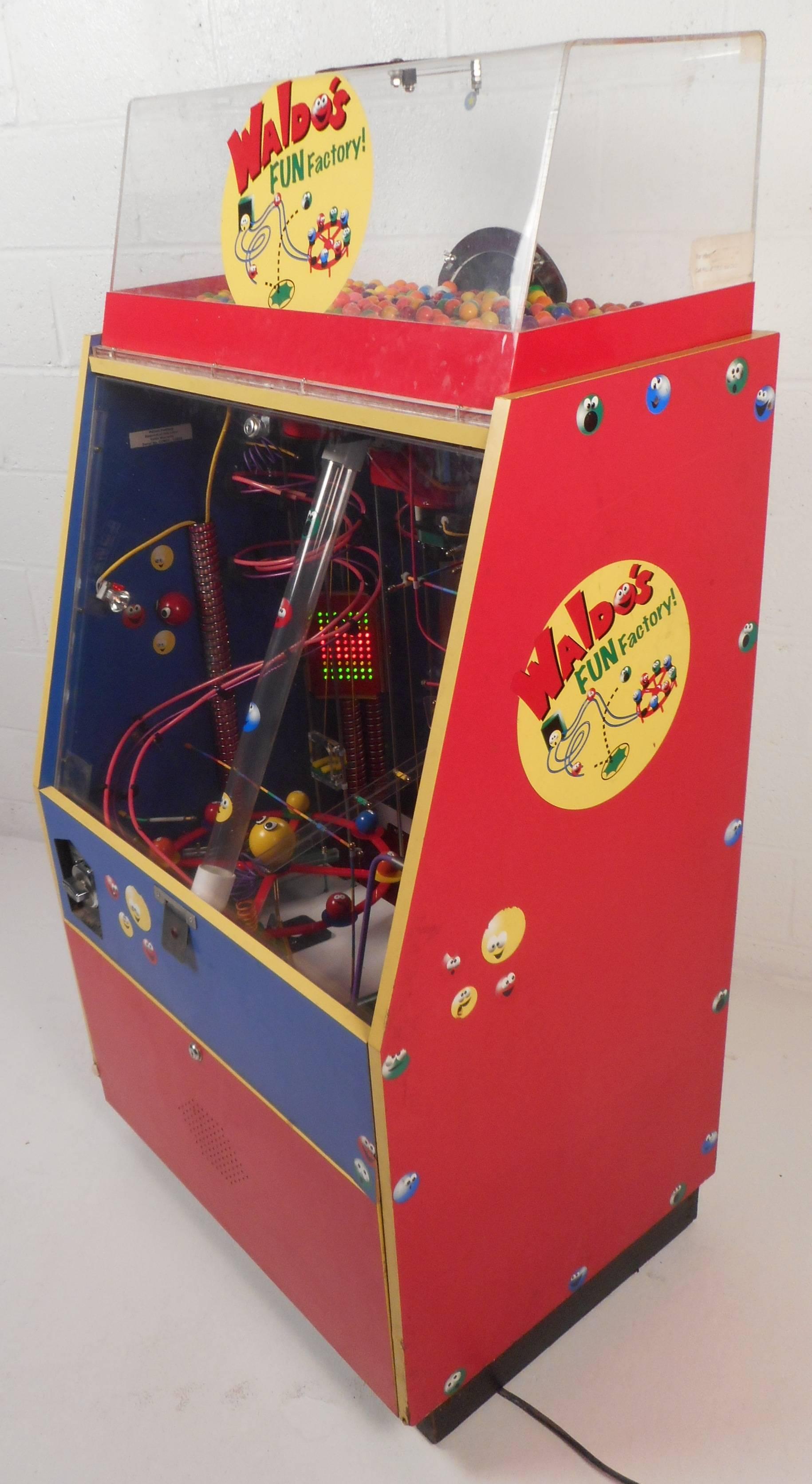 Incredible vintage gum ball machine features various bright colors and lights. Very unique and fun design offers intricate way to receive your gum ball. This quarter machine incorporates an arcade game and simple vending machine making this the