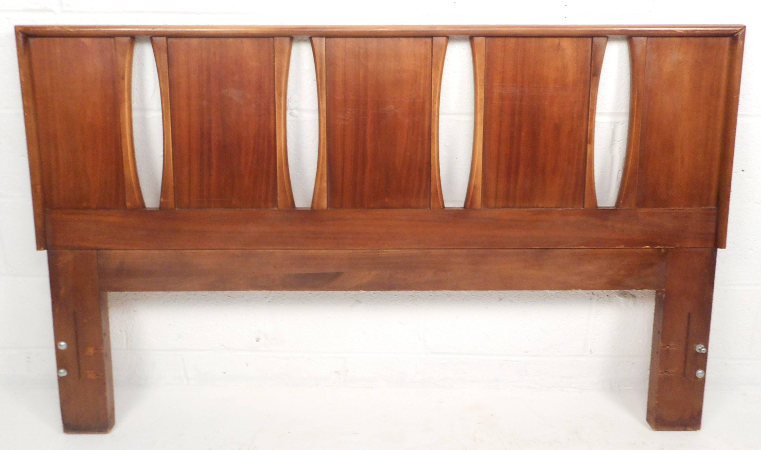 This beautiful vintage modern headboard features a vintage walnut finish with unique designs. Sleek design and sturdy construction makes this attractive queen-size headboard the perfect addition to any bedroom. Please confirm item location (NY or