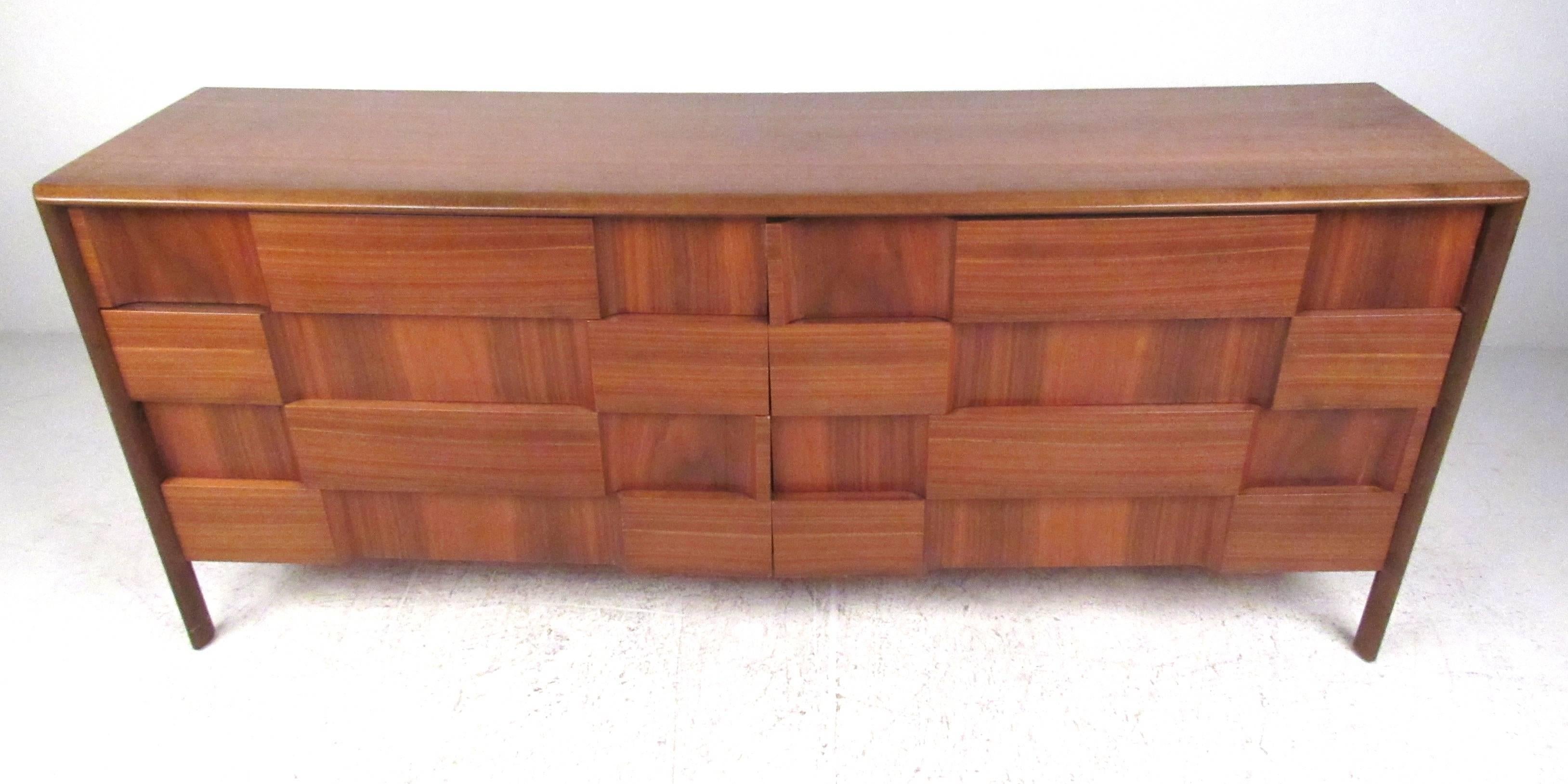 Eight-drawer walnut dresser by Edmond Spence, Sweden, circa 1960 makes an ideal nine drawer dresser, perfect for home bedroom. Sculptred checkerboard front makes an impressive addition to any interior, please confirm item location (NY or NJ). 