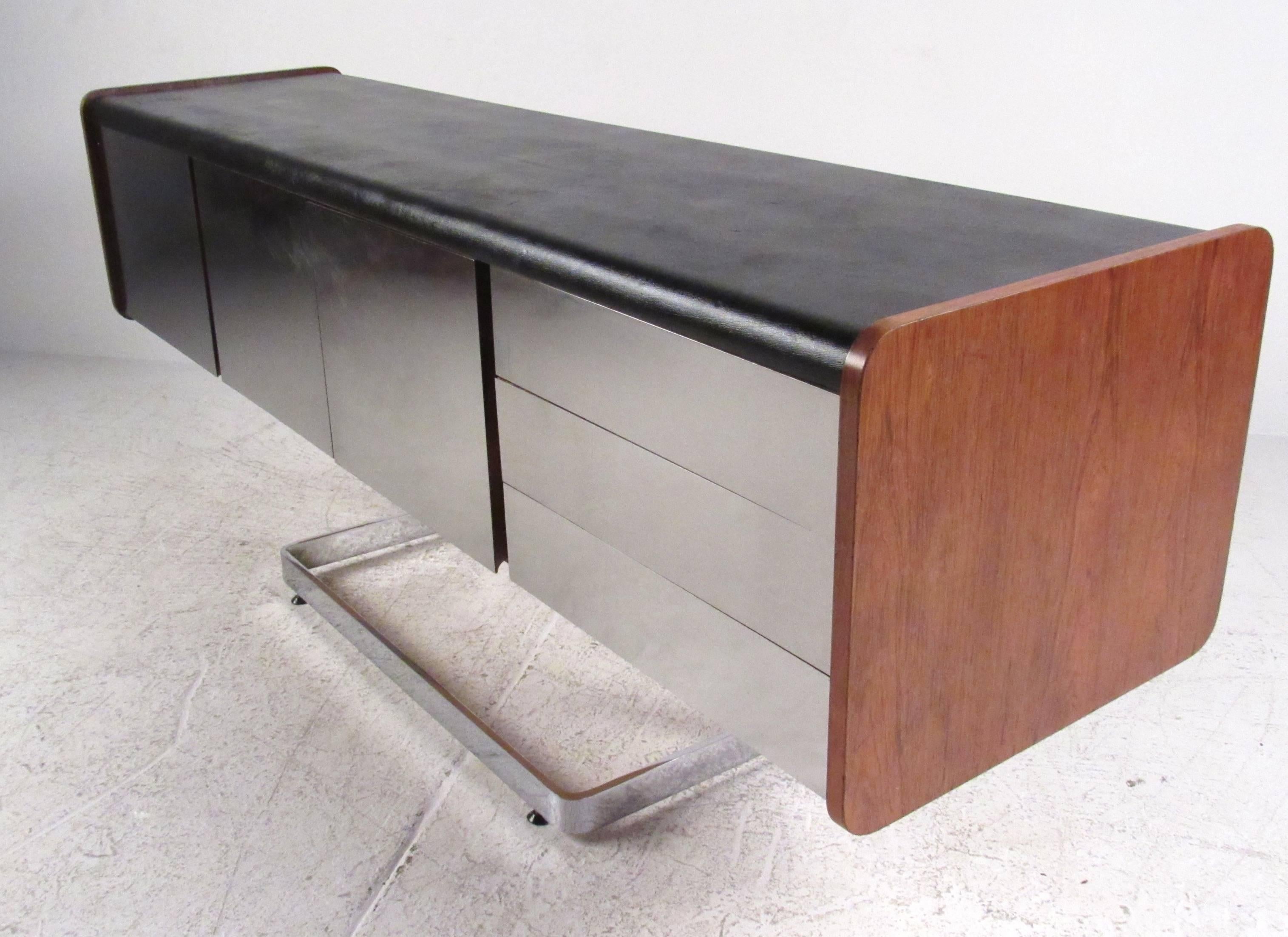 Chrome front cantilevered credenza with inset black leather top and walnut side panels by Ste. Marie & Laurent. Please confirm item location (NY or NJ) with dealer.