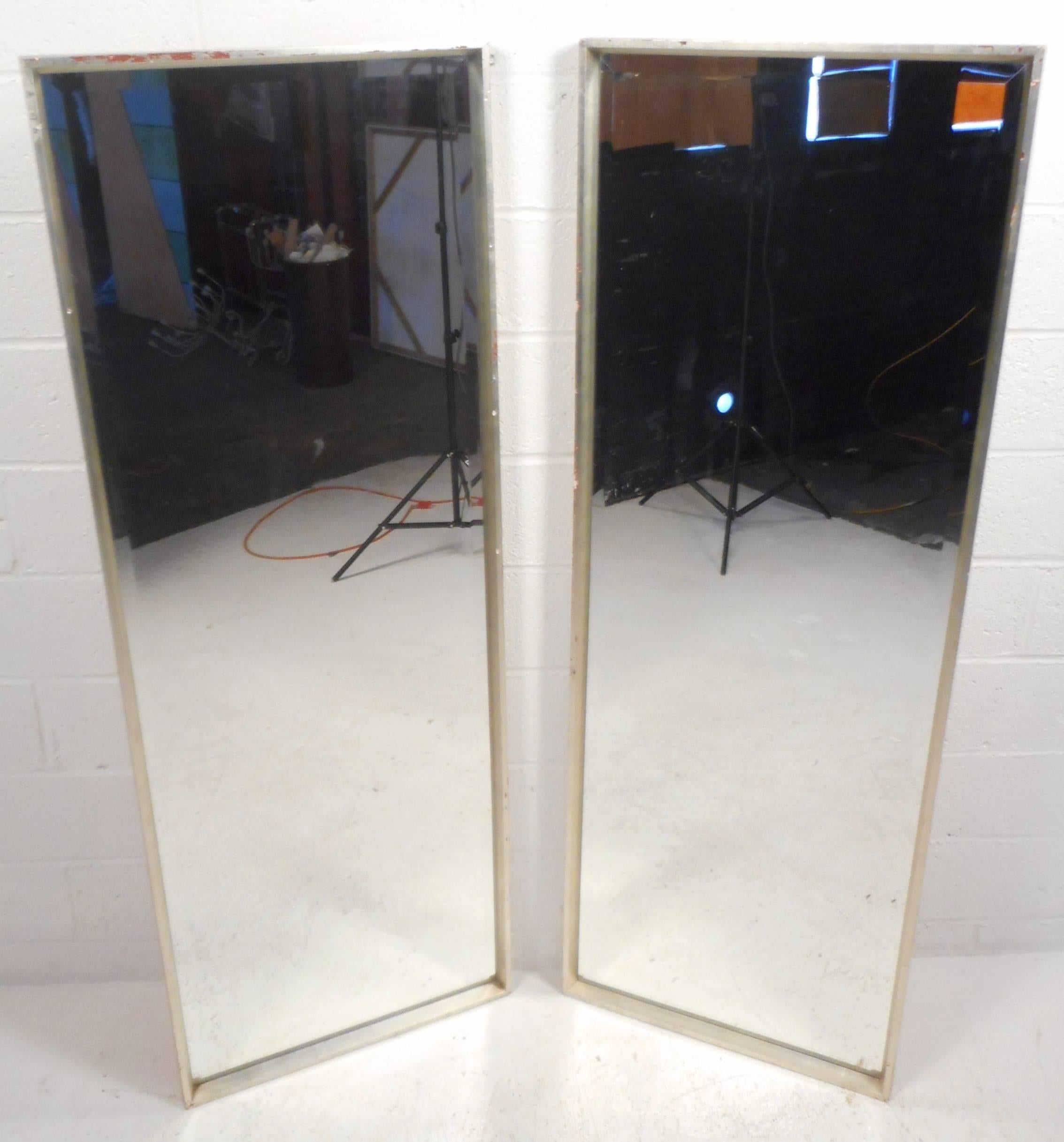 This impressive pair of vintage modern mirrors feature a solid wood frame and beveled trim. The price listed is for one mirror. We have sold one of them already, only one left in stock. Please confirm item location with dealer(NY or NJ).