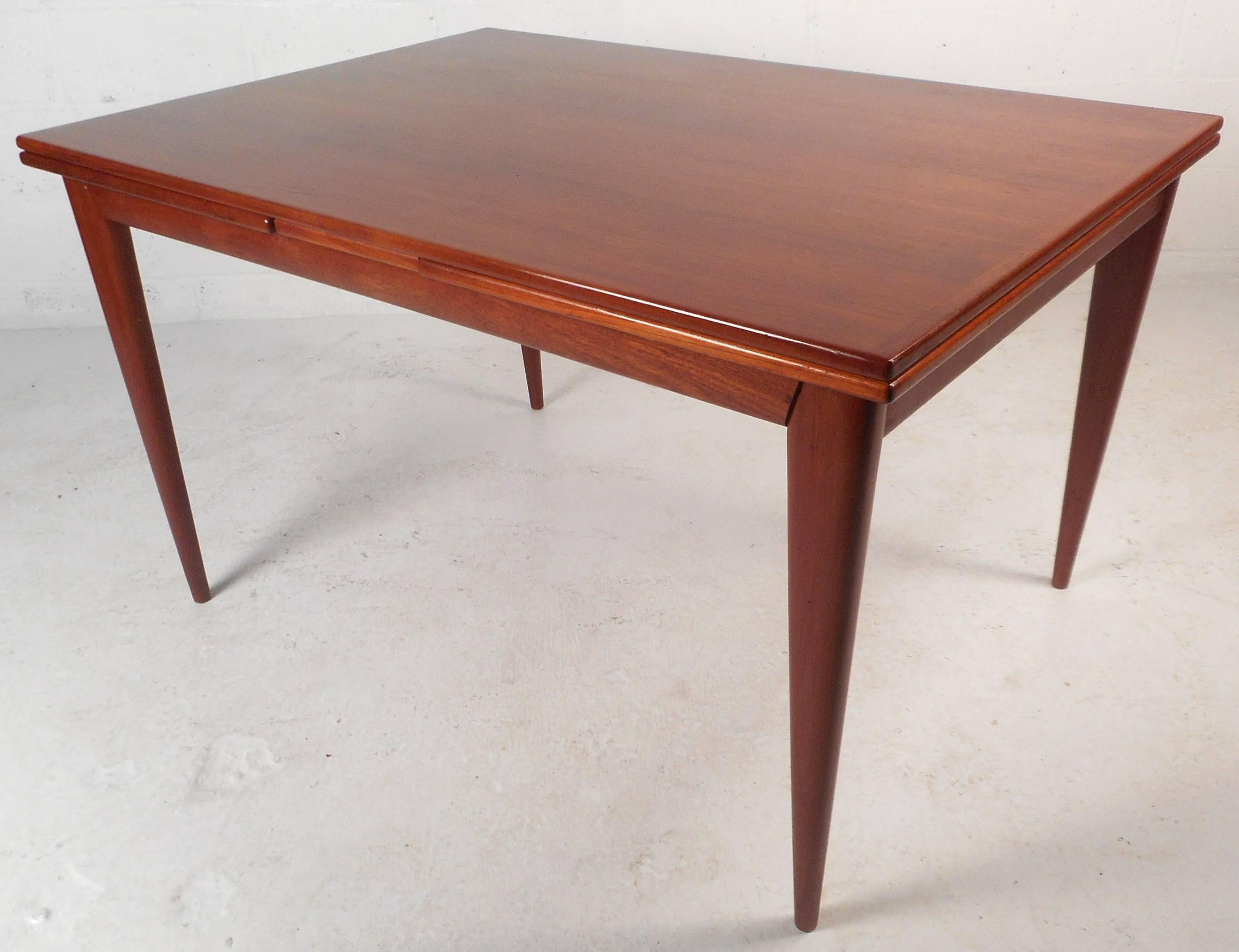 Impressive Mid-Century Modern Teak Draw-Leaf Dining Table by Niels Otto Møller In Good Condition In Brooklyn, NY