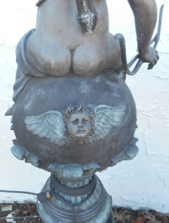 Impressive Pair of Bronze Statues Holding a Light Fixture For Sale at 1stdibs