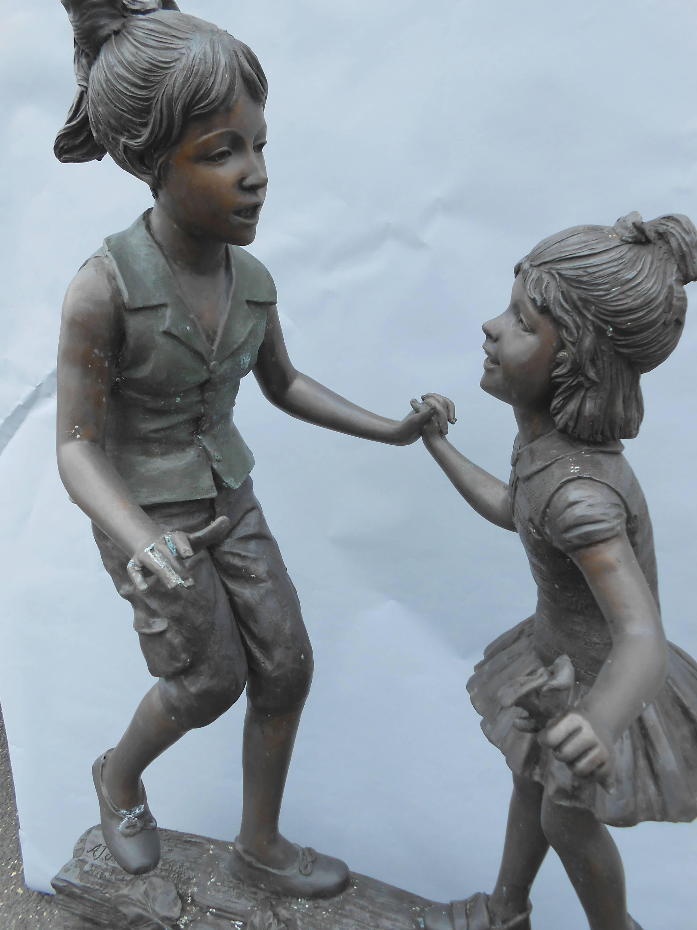 Stunning bronze statue features three children playing on a log with their puppy. This large sculpted statue shows incredible detail and creates a wonderful scene of youth. Wonderful design shows quality craftsmanship by AJ John. Impressive piece