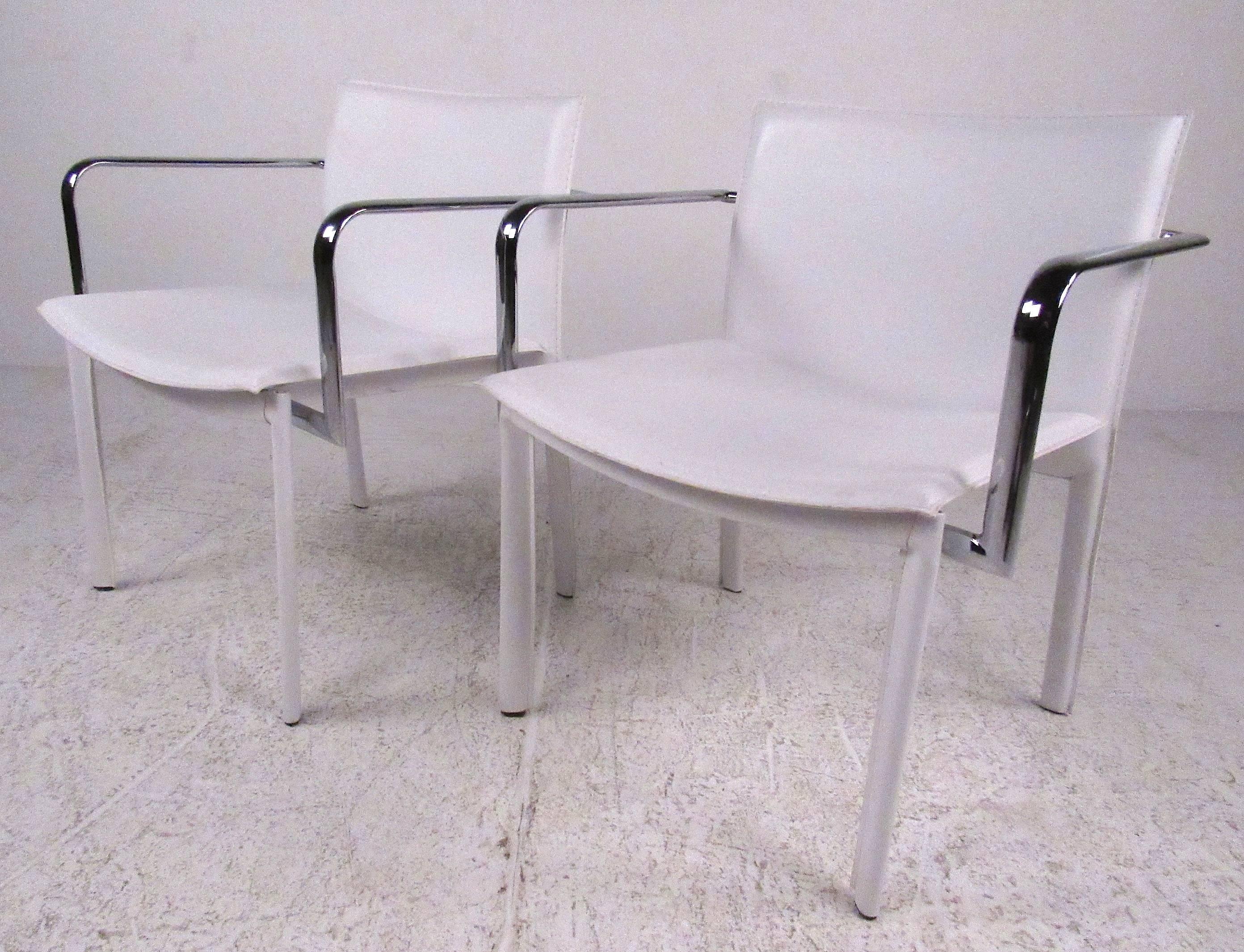 Stylish modern white leather side chairs with polished chrome arms. Please confirm item location (NY or NJ) with dealer.