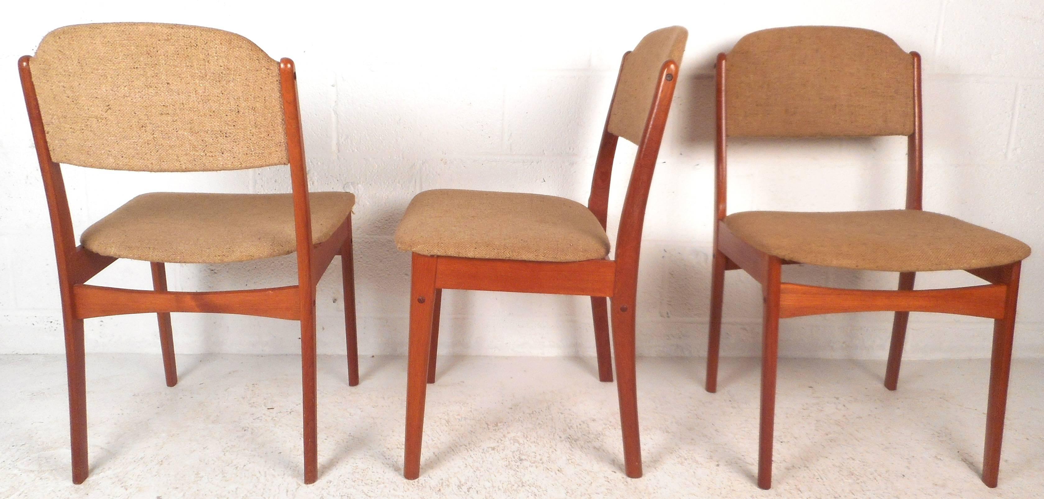 This elegant set of six vintage modern dining chairs feature sculpted frames with angled legs and back rests. Sleek design offers wide and comfortable seating without sacrificing style. Quality construction ensures sturdiness making this mid-century