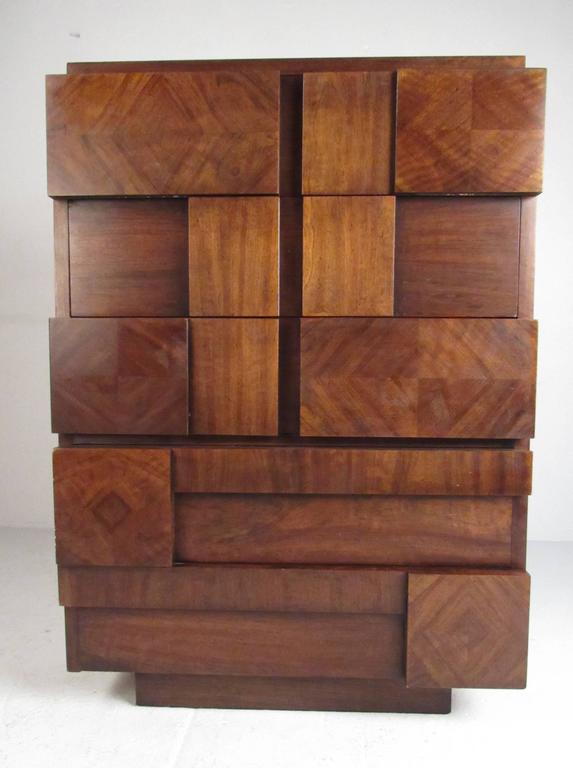 Mid-Century Modern highboy walnut dresser with five hidden drawers from the Brutalist mosaic design series by Lane. Please confirm item location (NY or NJ).