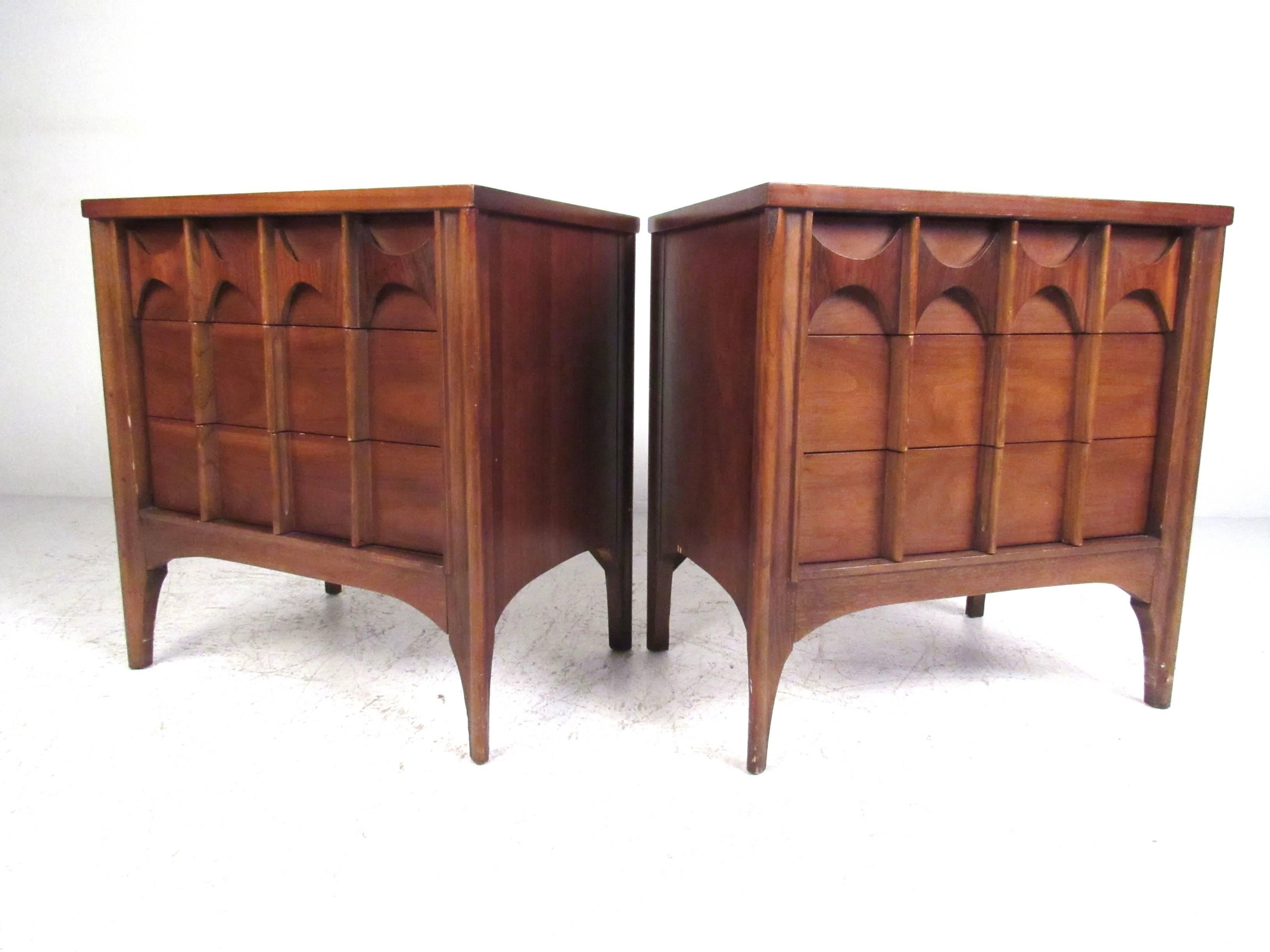 Attractive pair of Mid-Century three-drawer nightstands in the style of Broyhill Brasilia collection. Please confirm item location (NY or NJ) with dealer.