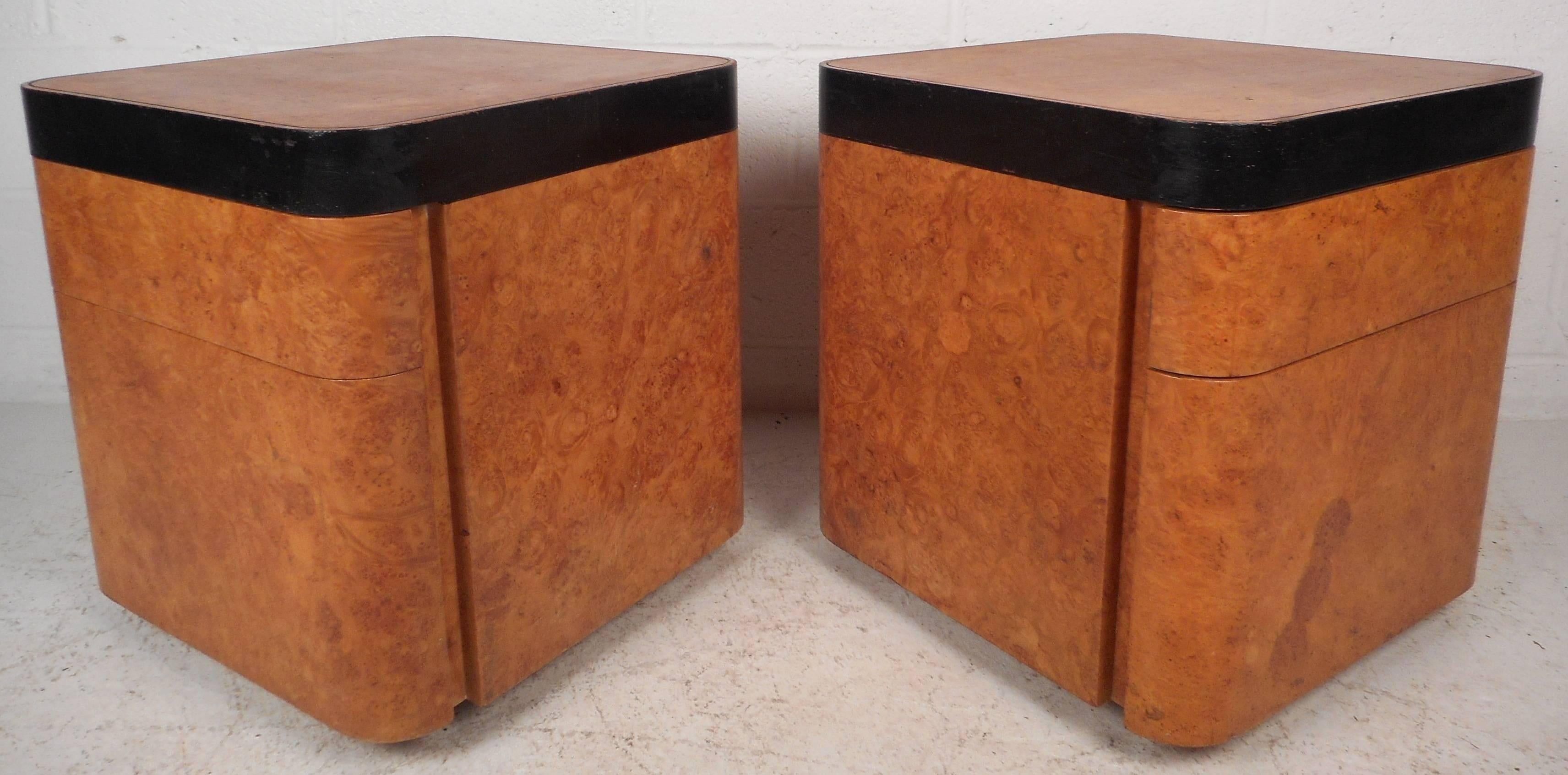 Beautiful pair of vintage modern burl end tables with a unique black wood strip around the top. Sleek two-tone design with ample storage space in its two hefty drawers. These versatile pieces can be used as night stands or end tables. This unique