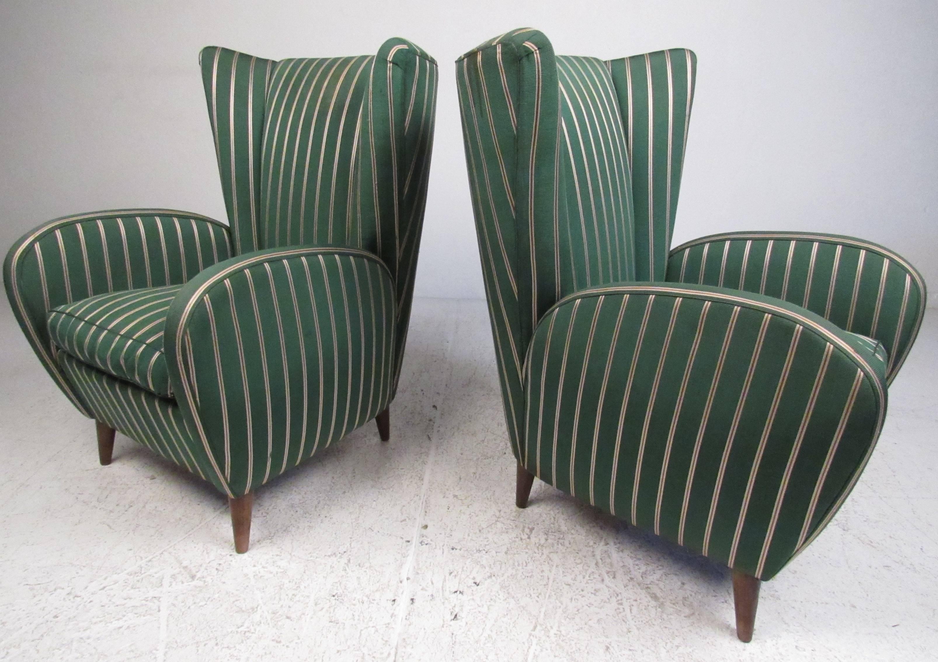 Dramatic pair of sculptural wing back chairs in the manner of Italian designer Paolo Buffa. Exquisite high back seating offers Italian modern elegance in any setting. Please confirm item location (NY or NJ) with dealer.