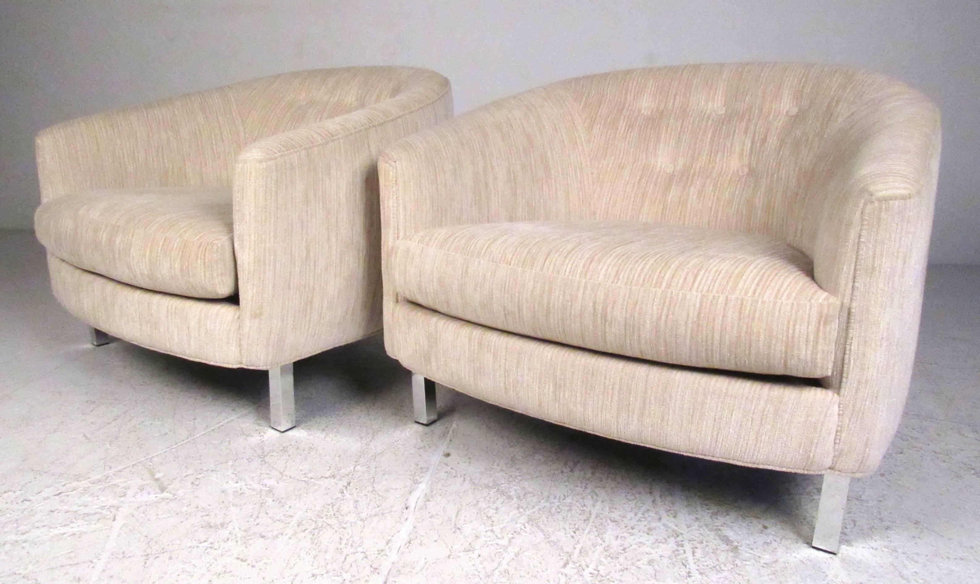 Pair of modern low profile lounge chairs with rounded tufted backs and square tube aluminum legs. Please confirm item location (NY or NJ) with dealer.