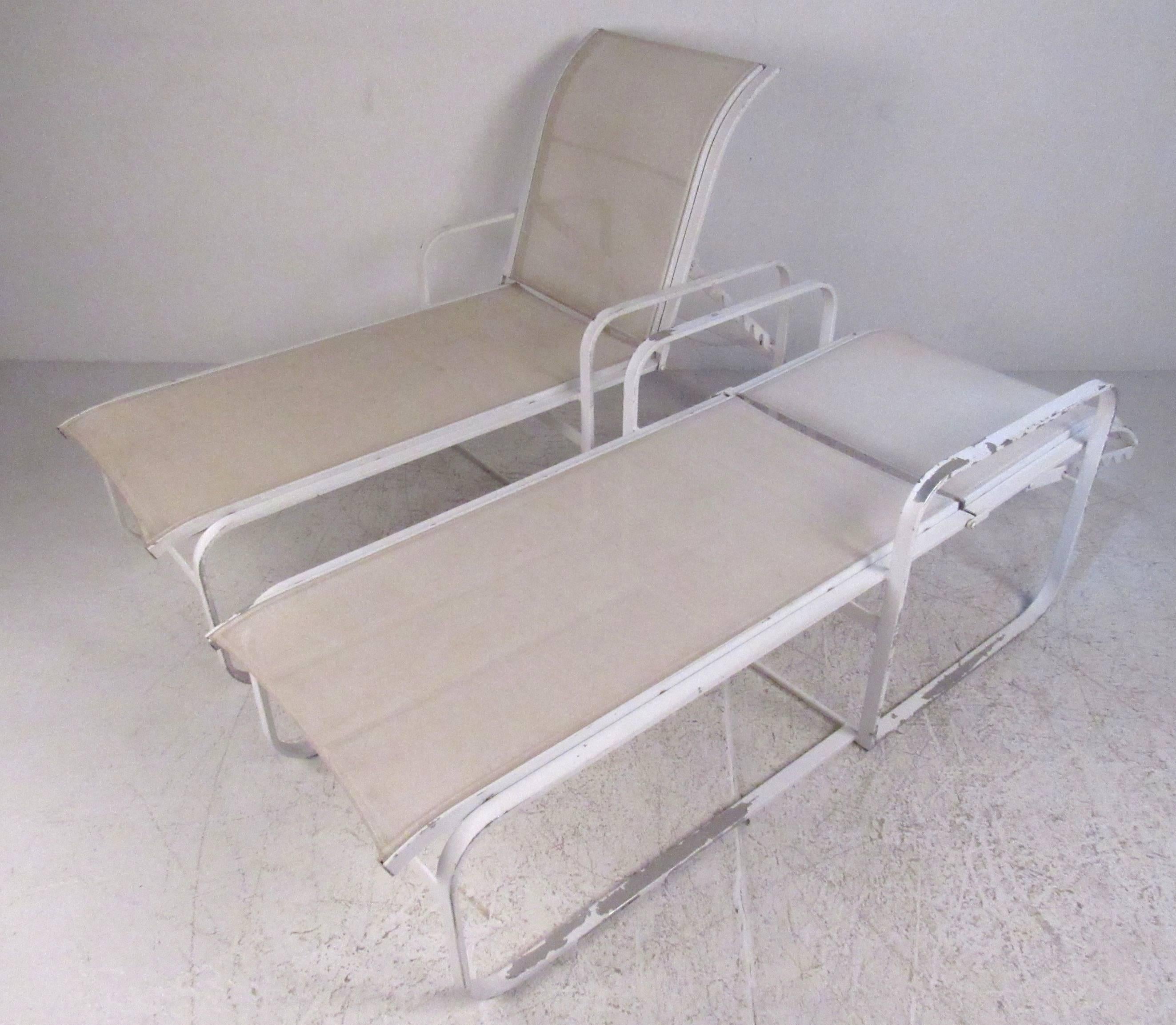 Pair of aluminum frame with nylon upholstery outdoor chaise longue chairs by the Woodard Furniture Co., circa 1980. Please confirm item location (NY or NJ) with dealer.