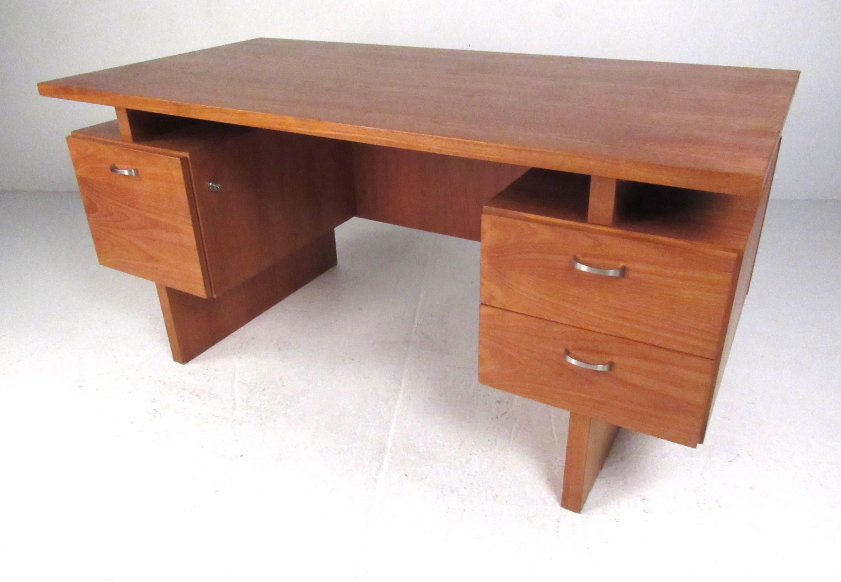 Sculptural floating top double pedestal desk by RS Associates of Montreal. Well constructed with three storage drawers, stainless pulls and finished back make this medium size desk a good fit for home or office. Please confirm item location (NY or