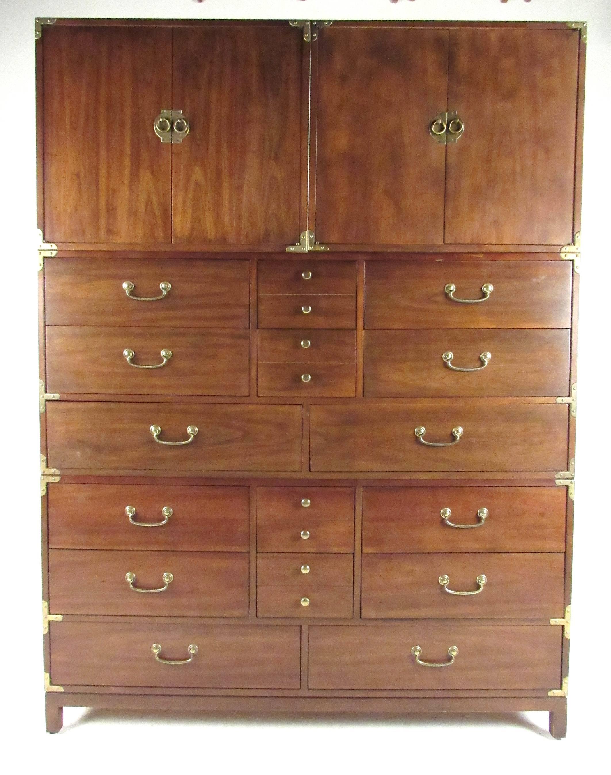 Impressive walnut with brass trim Campaign style dresser from the Barbados Line by Drexel. Four dressers provide 16 drawers of storage and two double door cabinets with adjustable shelves. Please confirm item location (NY or NJ) with dealer.