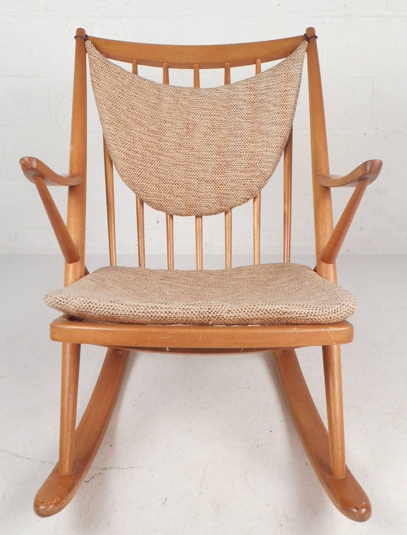 This beautiful vintage modern rocking chair features an unusual 