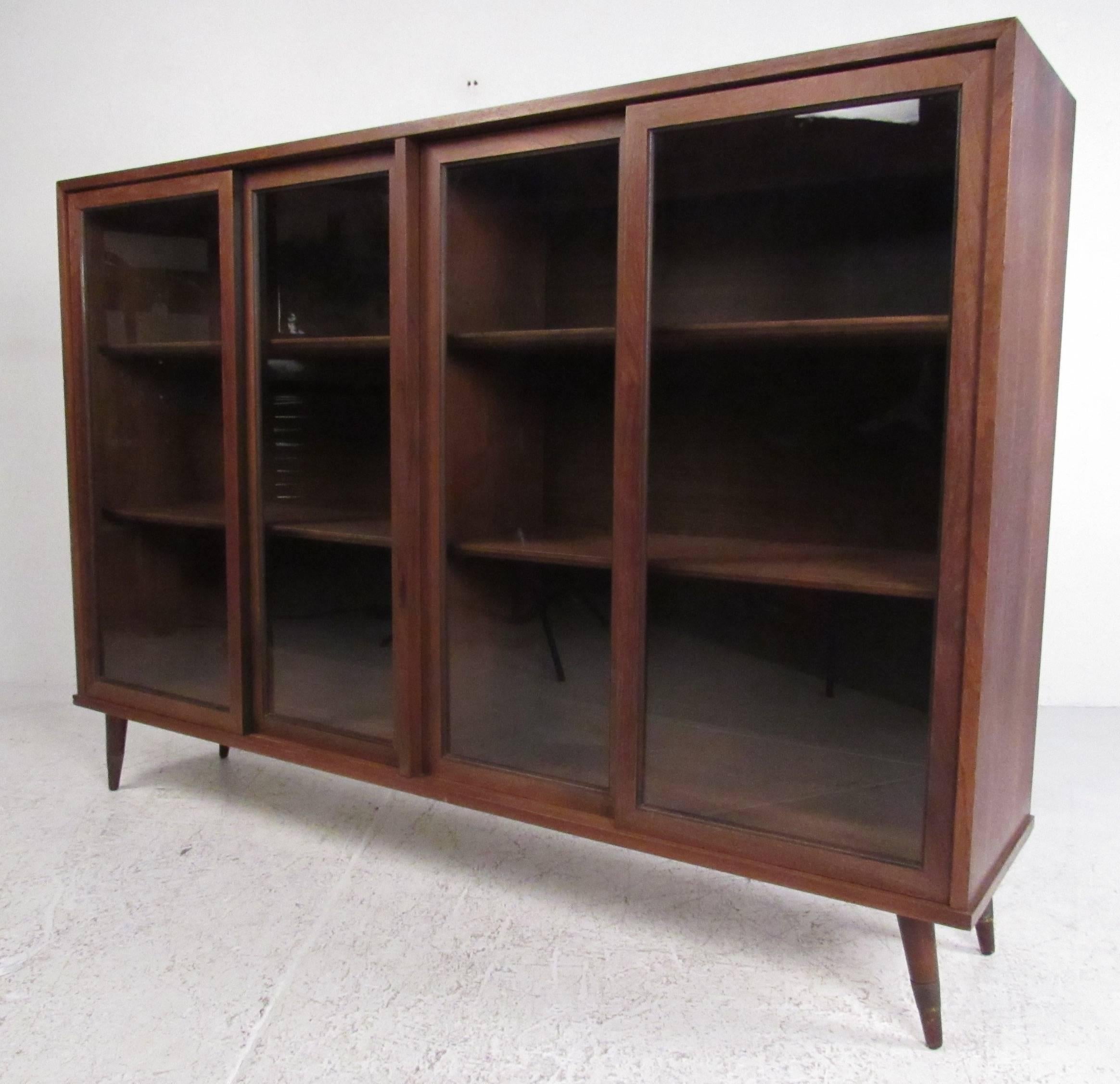 American walnut sliding door china cabinet with two display shelves. Please confirm item location (NY or NJ) with dealer.

 