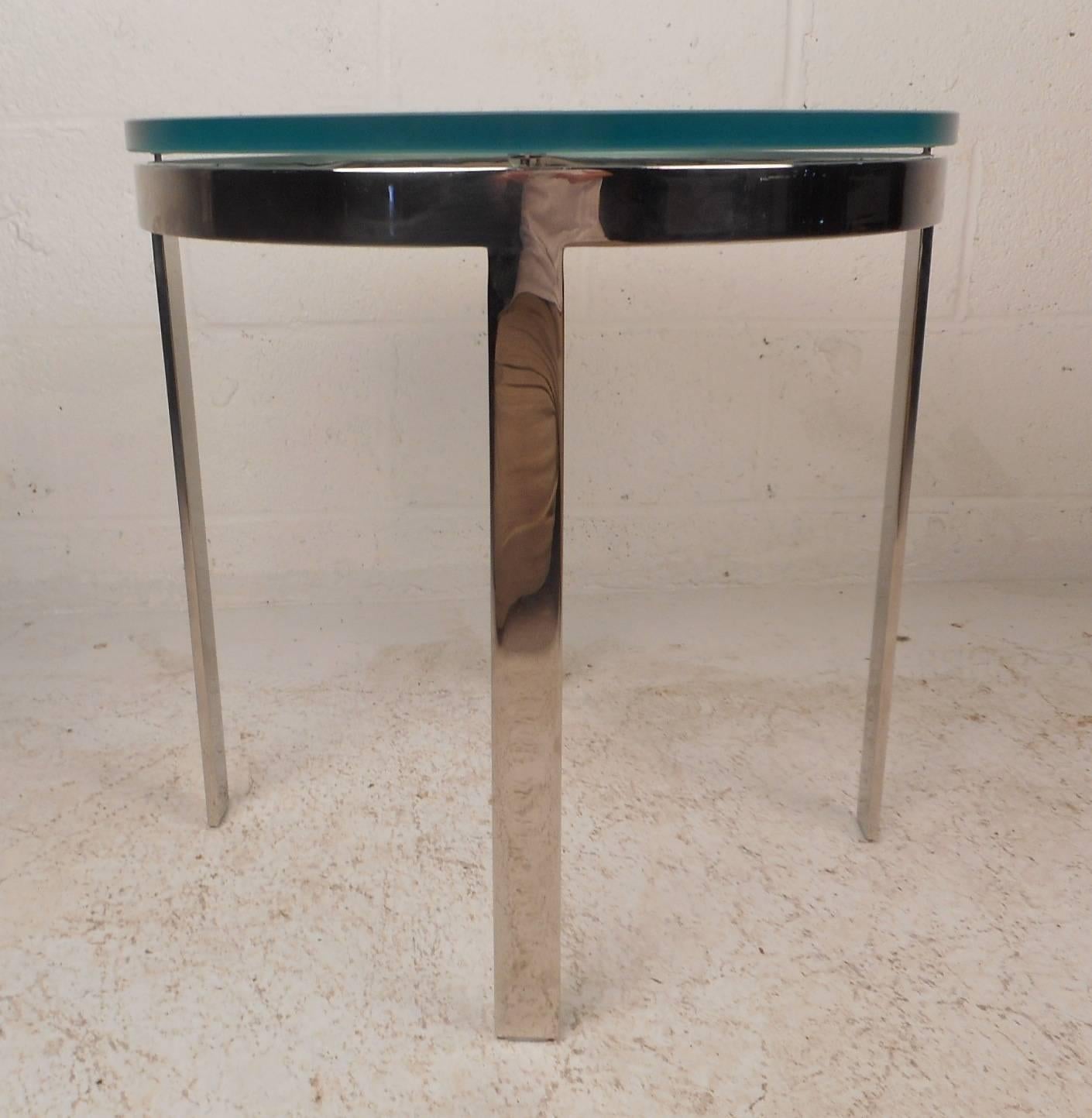 Stunning vintage modern end table with an unusual thick frosted glass top and a heavy flat bar chrome frame. Unique design has an incredible glass top with a light tint of green and stands on four sturdy legs. This Mid-Century Modern piece makes the