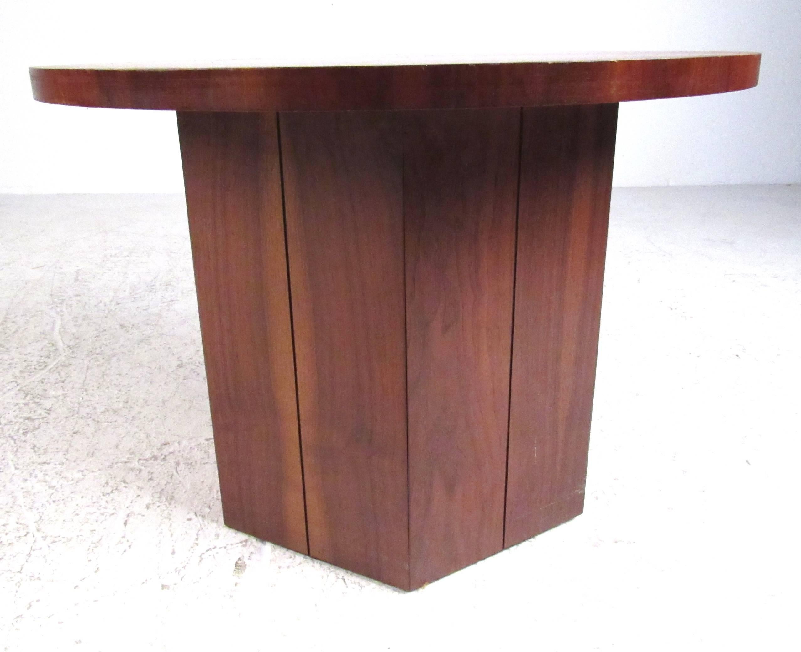 Mid-Century Modern style round walnut top supported by a hexagonal base from the Lane Altavista collection.
