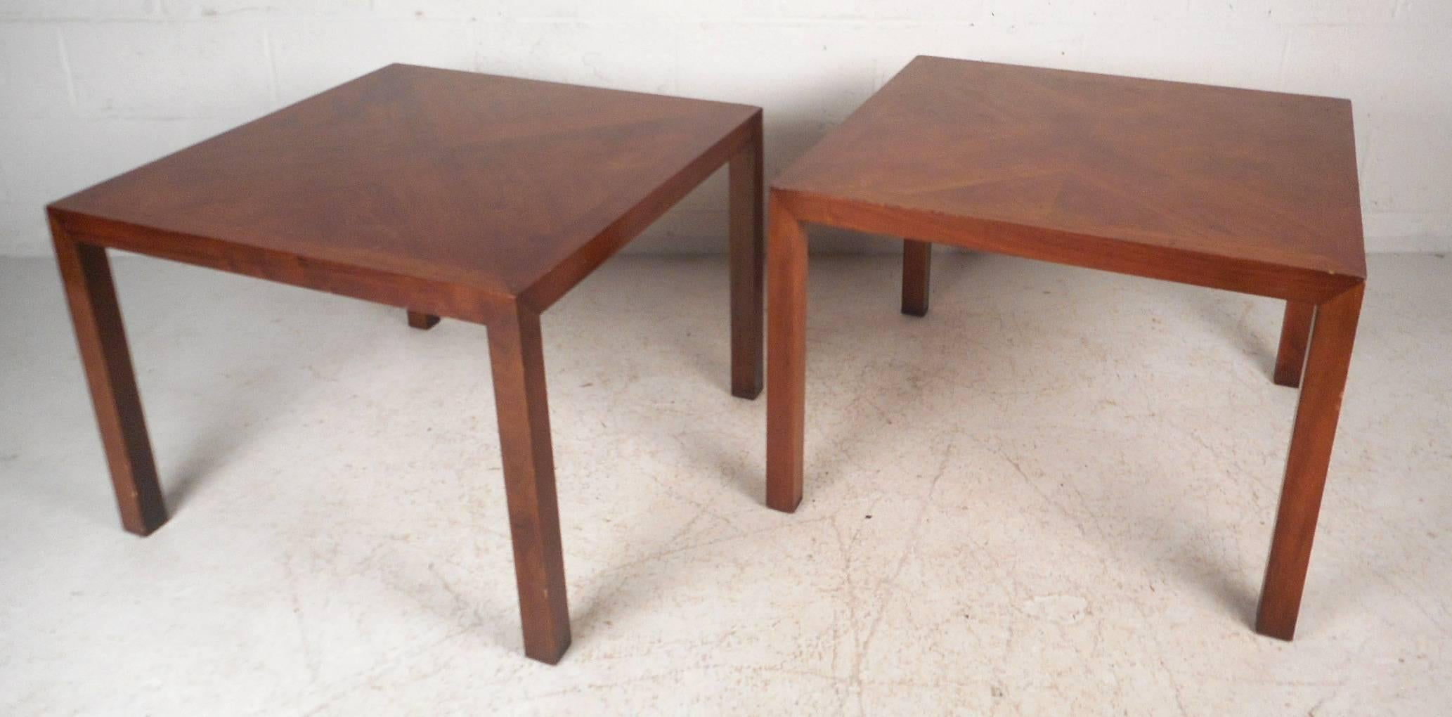 Beautiful pair of vintage modern end tables features a unique walnut wood grain on top running in different directions. Sleek and sturdy design shows true quality craftsmanship by Lane Furniture Company. The stylish wide square top provides plenty
