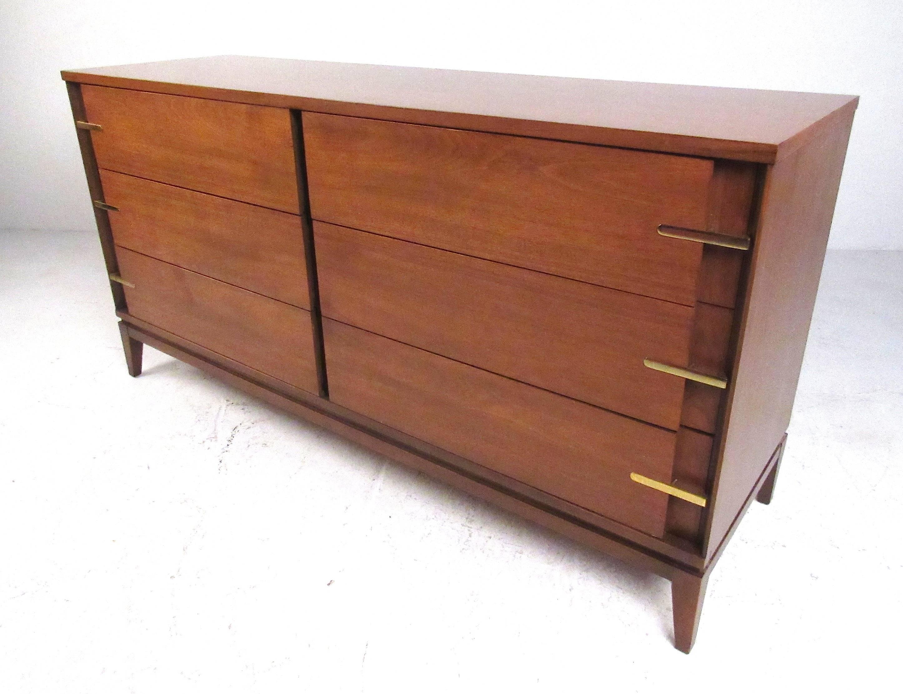 Classic Mid-Century Modern design six drawer walnut dresser with brass pulls by Basic Witz Furniture Co., Virginia.