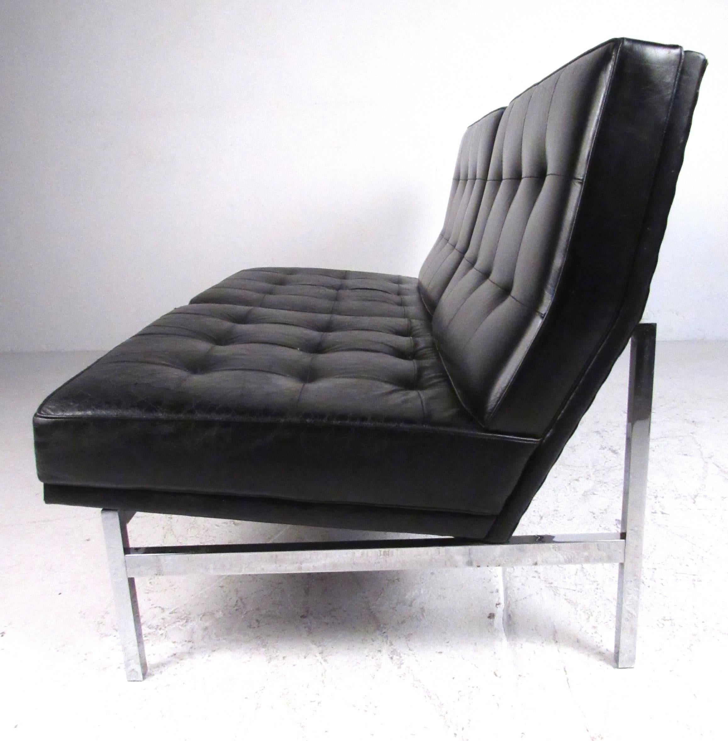 Classic Mid-Century Modern style two-seat leather tufted sofa supported by a tubular chrome frame. Comfortable and stylish design ideal for both home or office environments. Please confirm item location (NY or NJ) with dealer.
 
