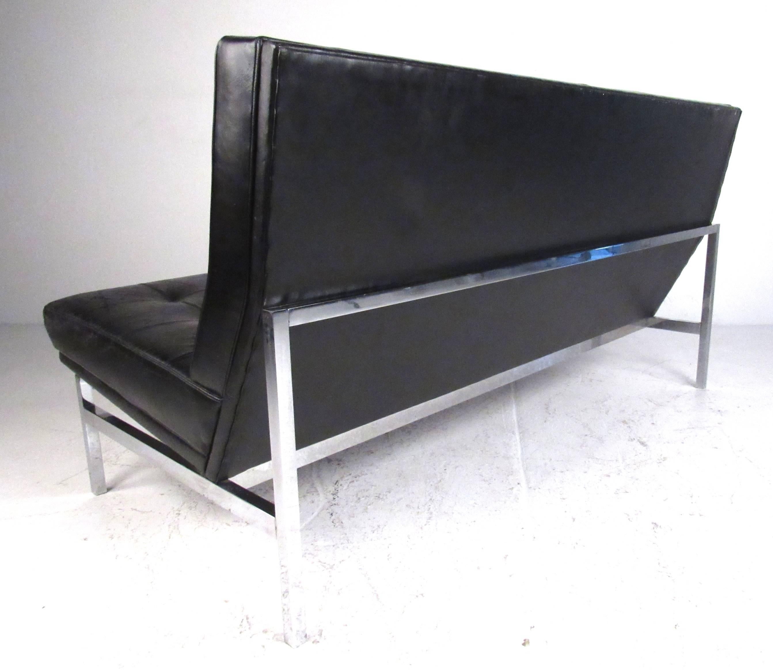 tufted armless sofa