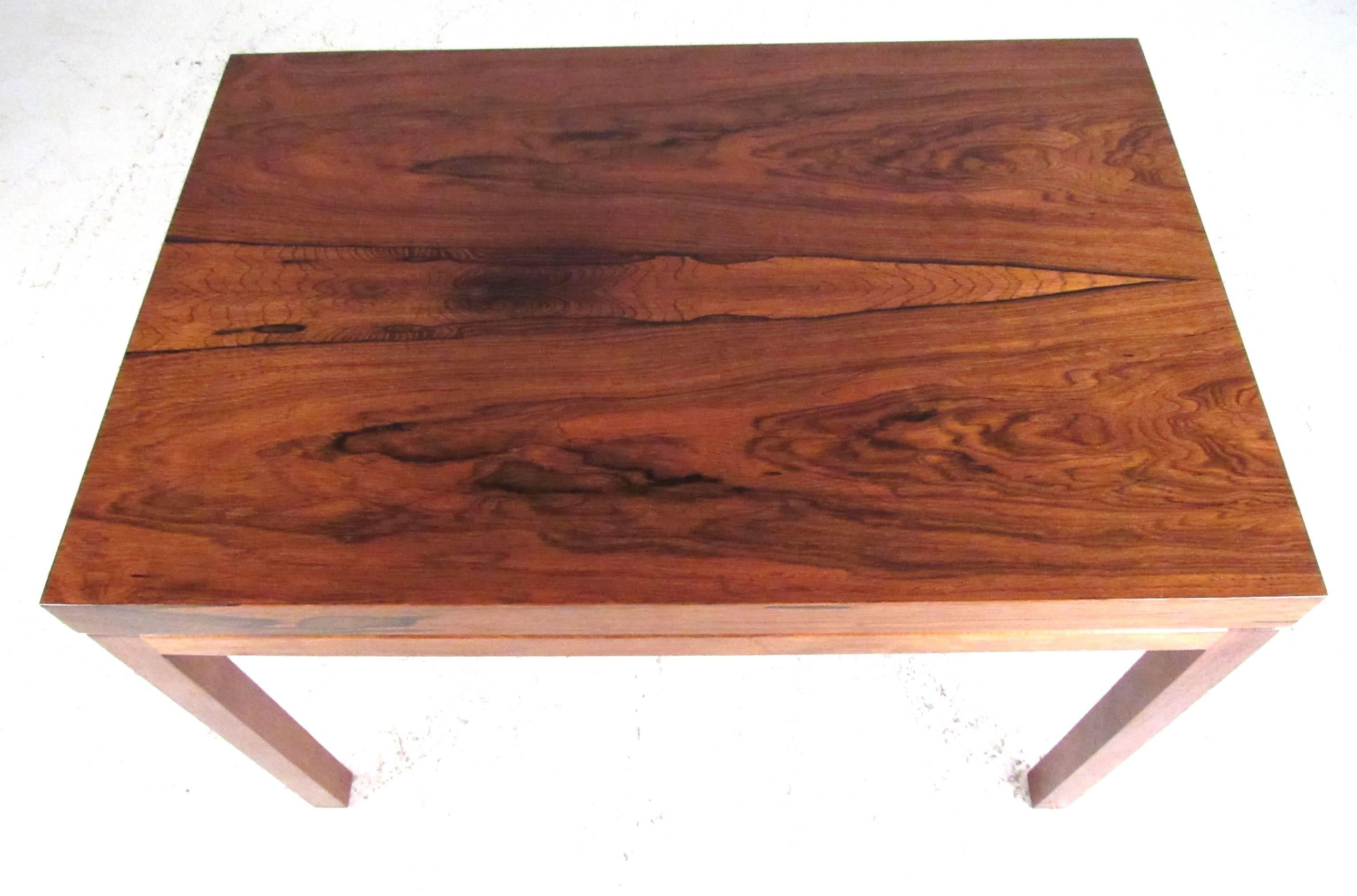 An elegant rectangular rosewood coffee table designed by Milo Baughman for Thayer Coggin, circa 1960s. Very nice vintage condition with original label.