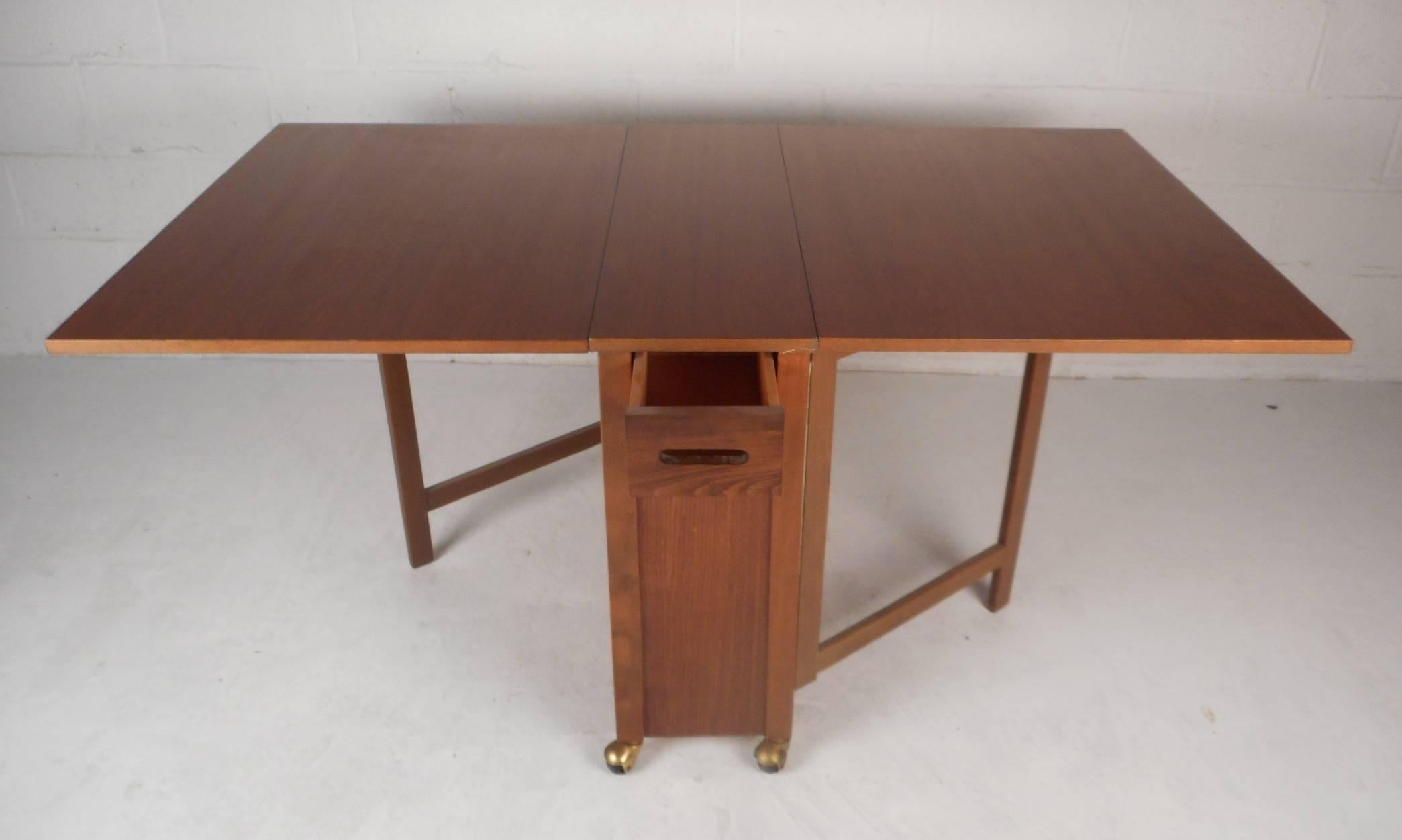 danish drop leaf table with chair storage
