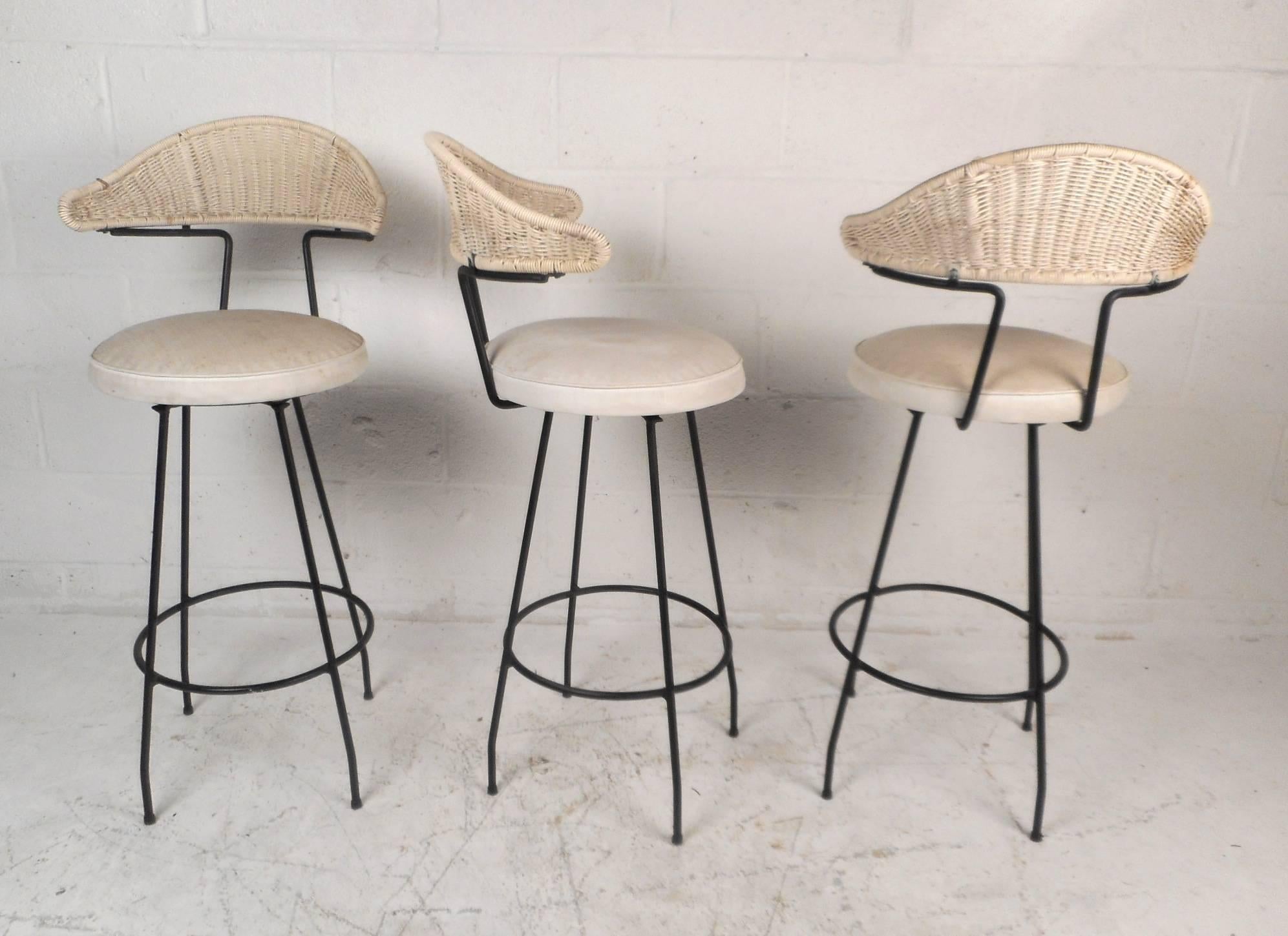 This gorgeous set of three bar stools feature unique curved woven back rests and a wrought iron base. Stylish design with thick padded seating covered in soft white fabric ensuring maximum comfort. This versatile set of stools make the perfect