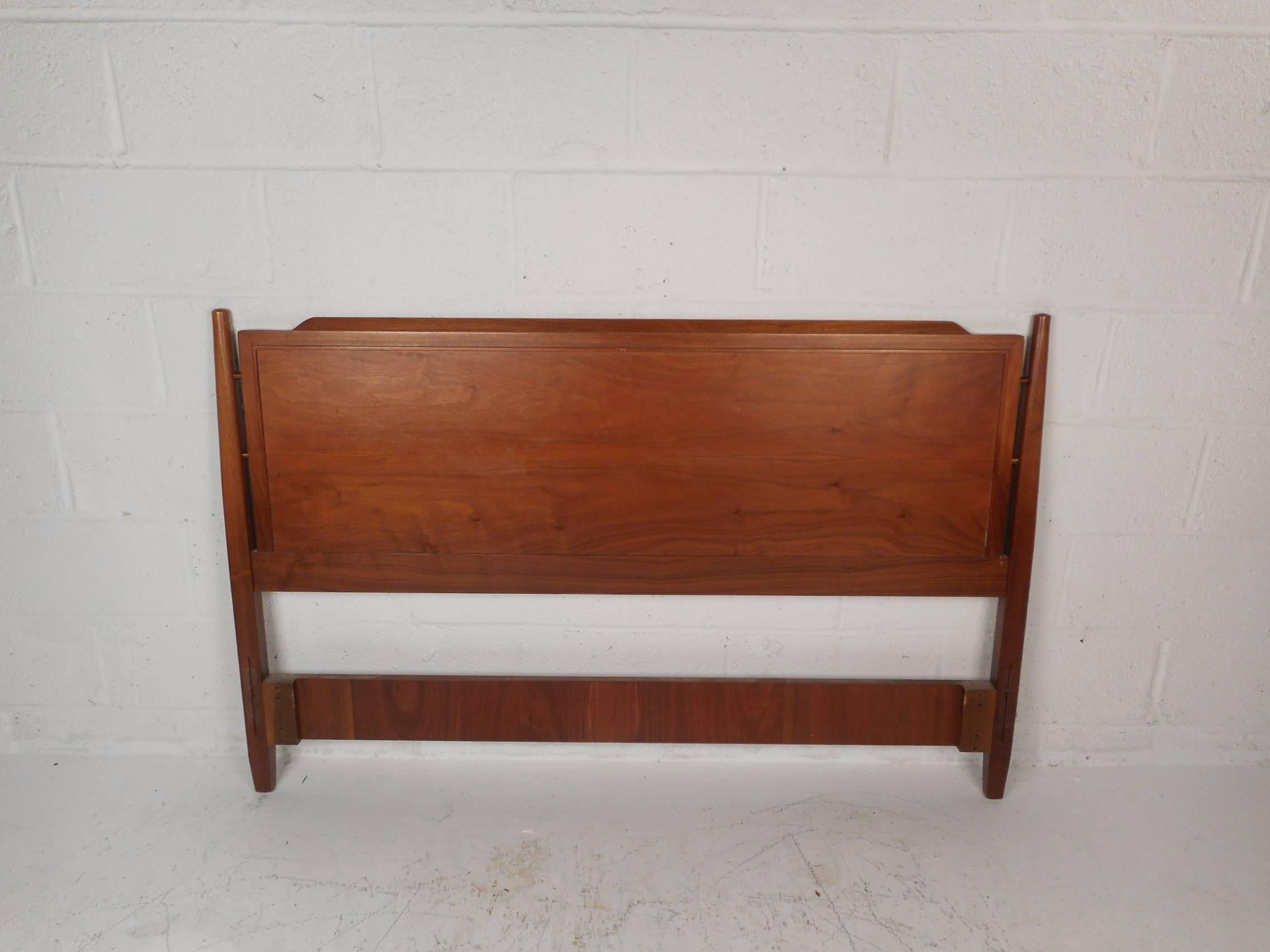 This beautiful vintage modern set includes a headboard, footboard, and stretchers. Sculpted design with unique tapered legs and elegant walnut wood grain throughout. This bed frame measures out at 56 inches wide and 79 inches deep. Please confirm