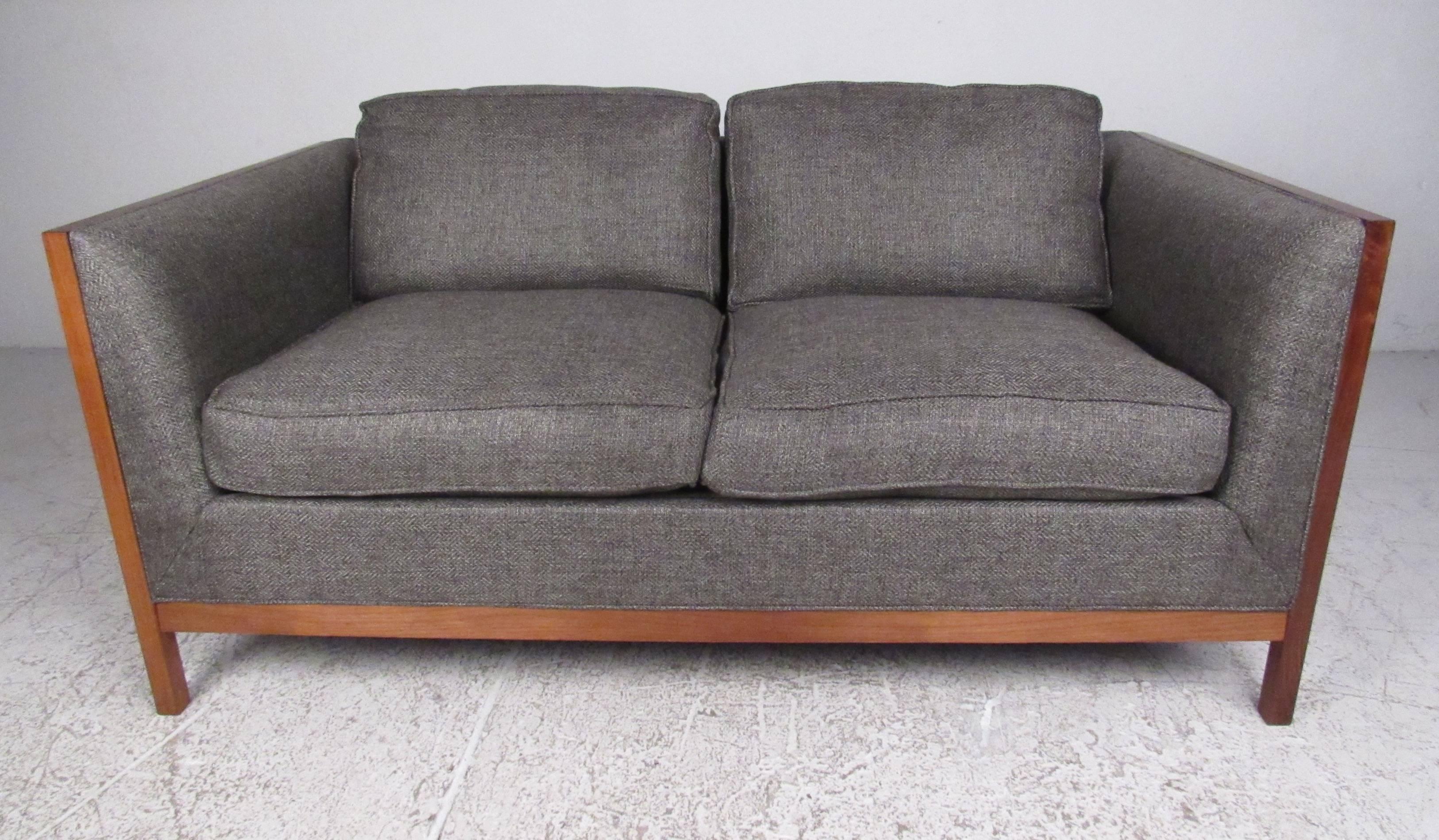 Comfortable and attractive, this solid walnut frame sofa by Stow Davis will make a stylish midcentury addition to any home or office environment. Please confirm item location (NY or NJ) with dealer.