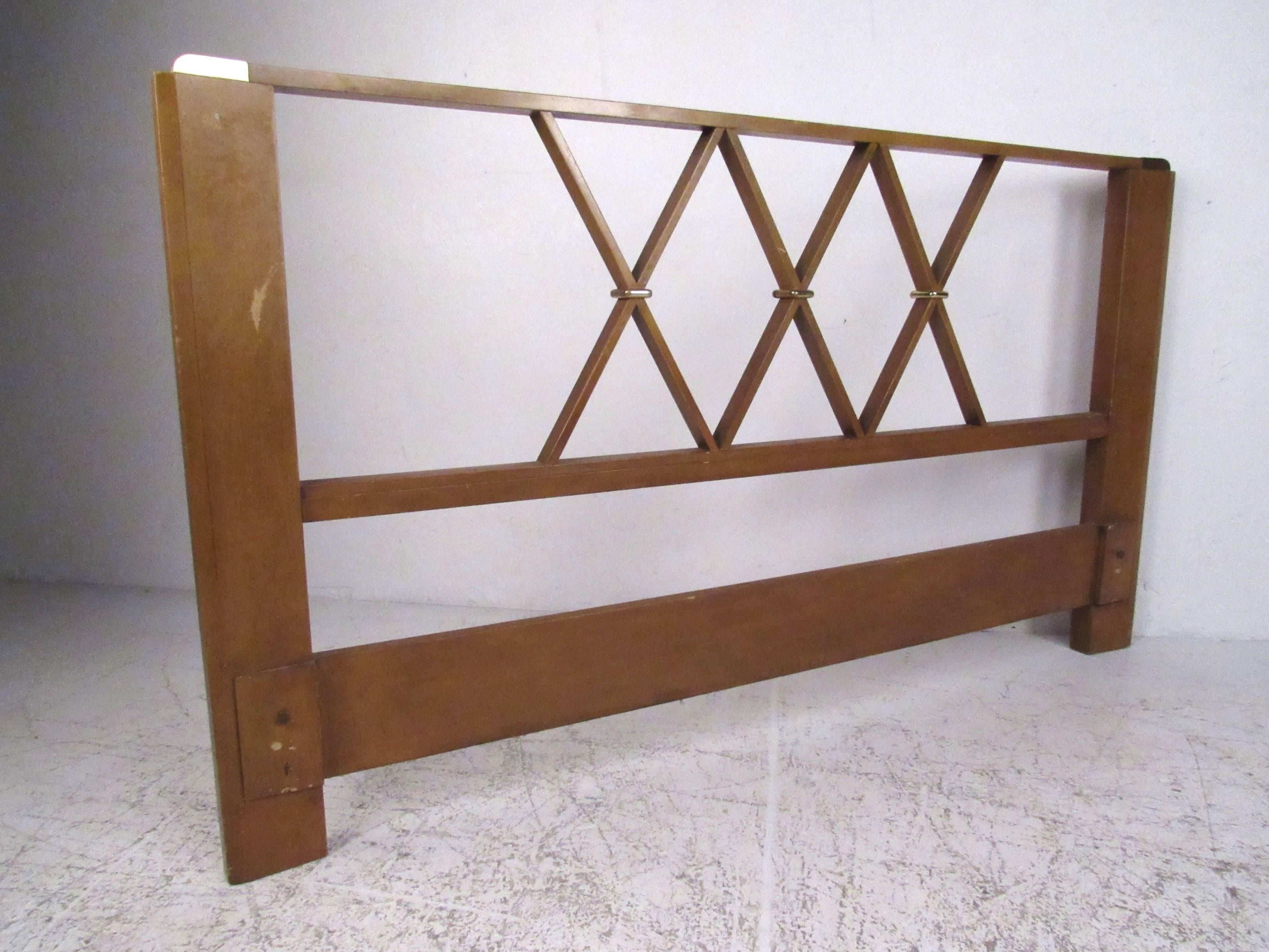 Queen-size headboard in mahogany with brass corsets and accents by Paul Frankl for Johnson Furniture, circa 1940s. Please confirm item location (NY or NJ) with dealer.
 