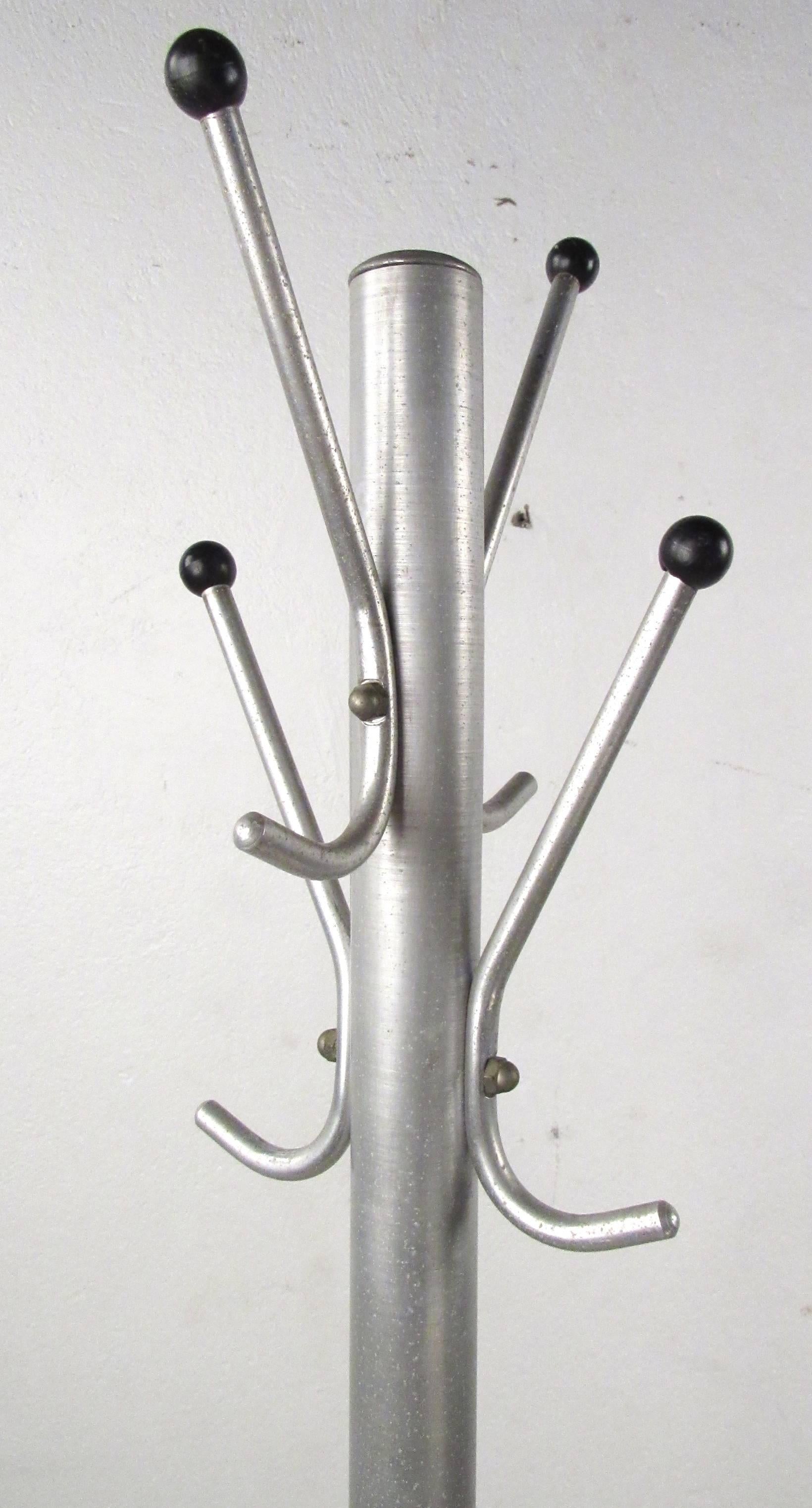 1960s era freestanding aluminum coat stand with heavy weighted base and industrial styling. Please confirm item location (NY or NJ) with dealer.
