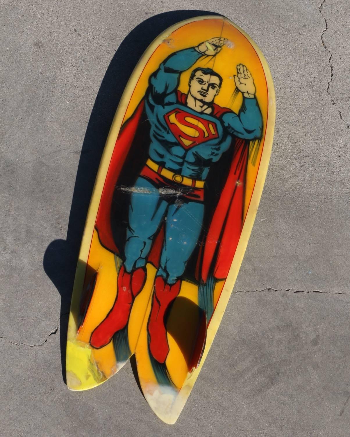 This Superman pocket rocket surfboard makes the ultimate super hero statement! All super-heros are good but superman is the best. Original condition, complete with dings, scratches and some old school repairs prove its authenticity.

This late