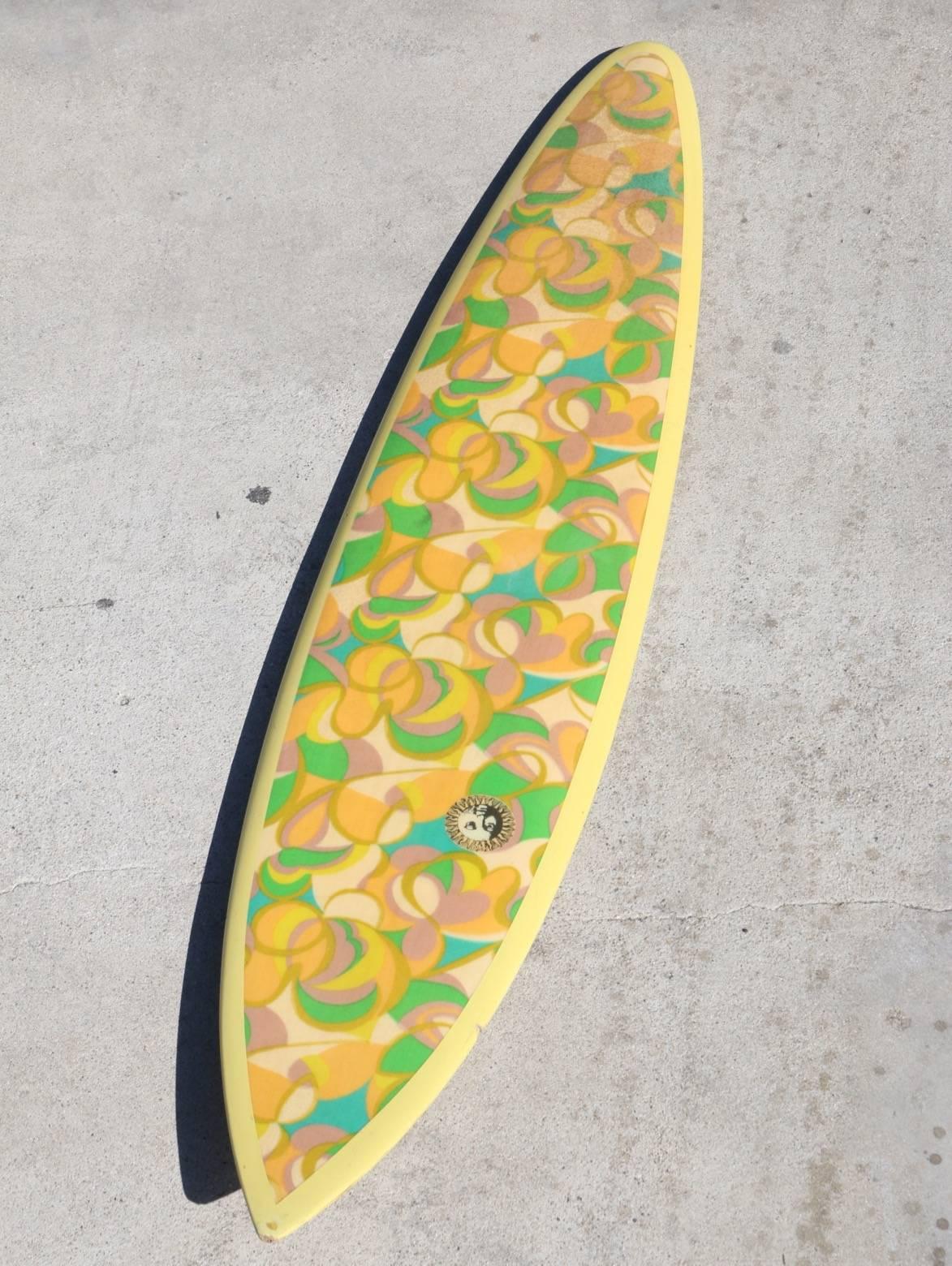 The fantastic array of patterned sherbet colors: Orange, lime, lemon, watermelon and honeydew with mango rails and bottom make this all original 1960s dextra big-wave-gun surfboard a sure Stand-out from a period of California history that dreams are