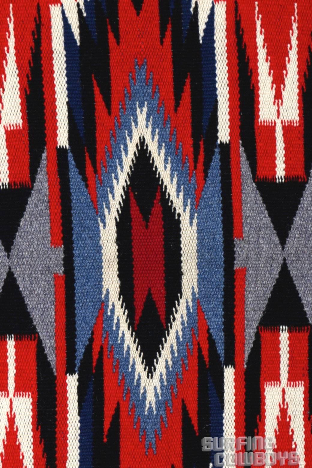 Stunning, circa 1930s handwoven Chimayo blanket in unused, virtually mint condition with vibrant colors and striking design. It's rare to find an original blanket from this period in such amazing condition.

This graphically interesting and large