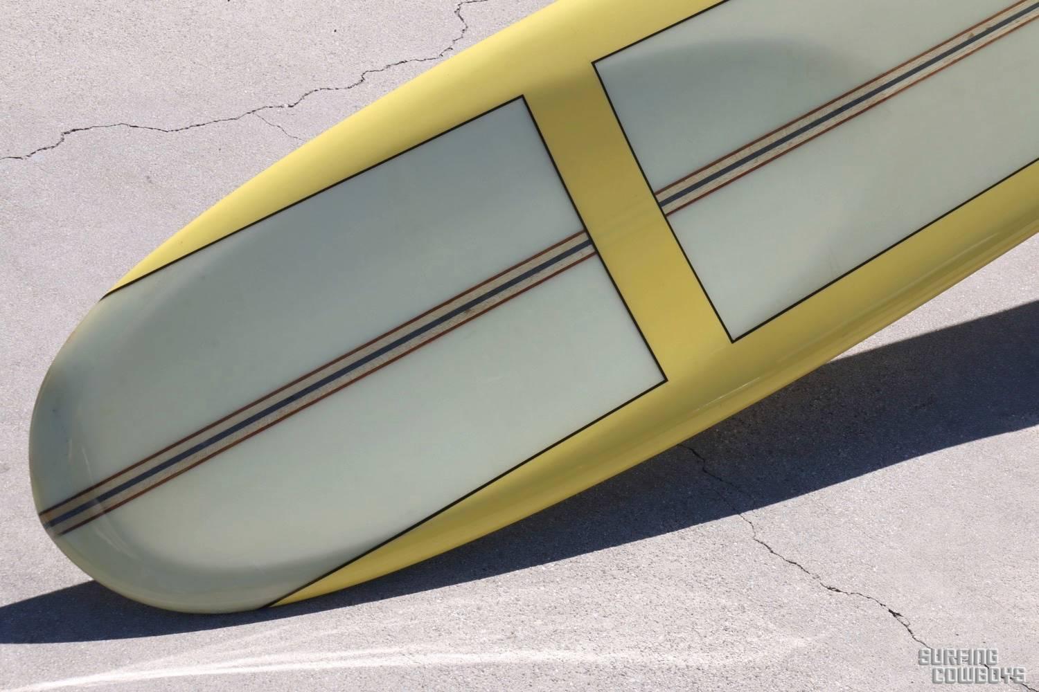 This unbelievably beautiful surfboard is arguably the best noserider ever created. If in doubt check out Joe Aaron riding one on YouTube. 
Yellow rails, black pin striping, five stringers in balsa, redwood and blue. Scooped out nose for nose