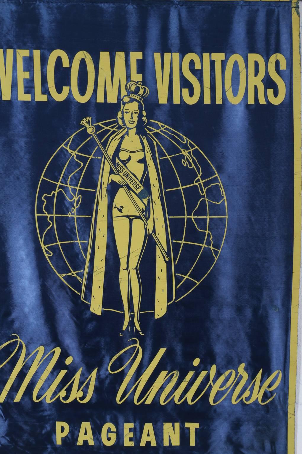 Miss Universe Pageant Welcome Banner from the first 1952 Miss Universe Pageant which took place in Long Beach, California. A classic piece of American popular culture and an iconic wall hanging display. This banner measures 45 inches high x 29.5