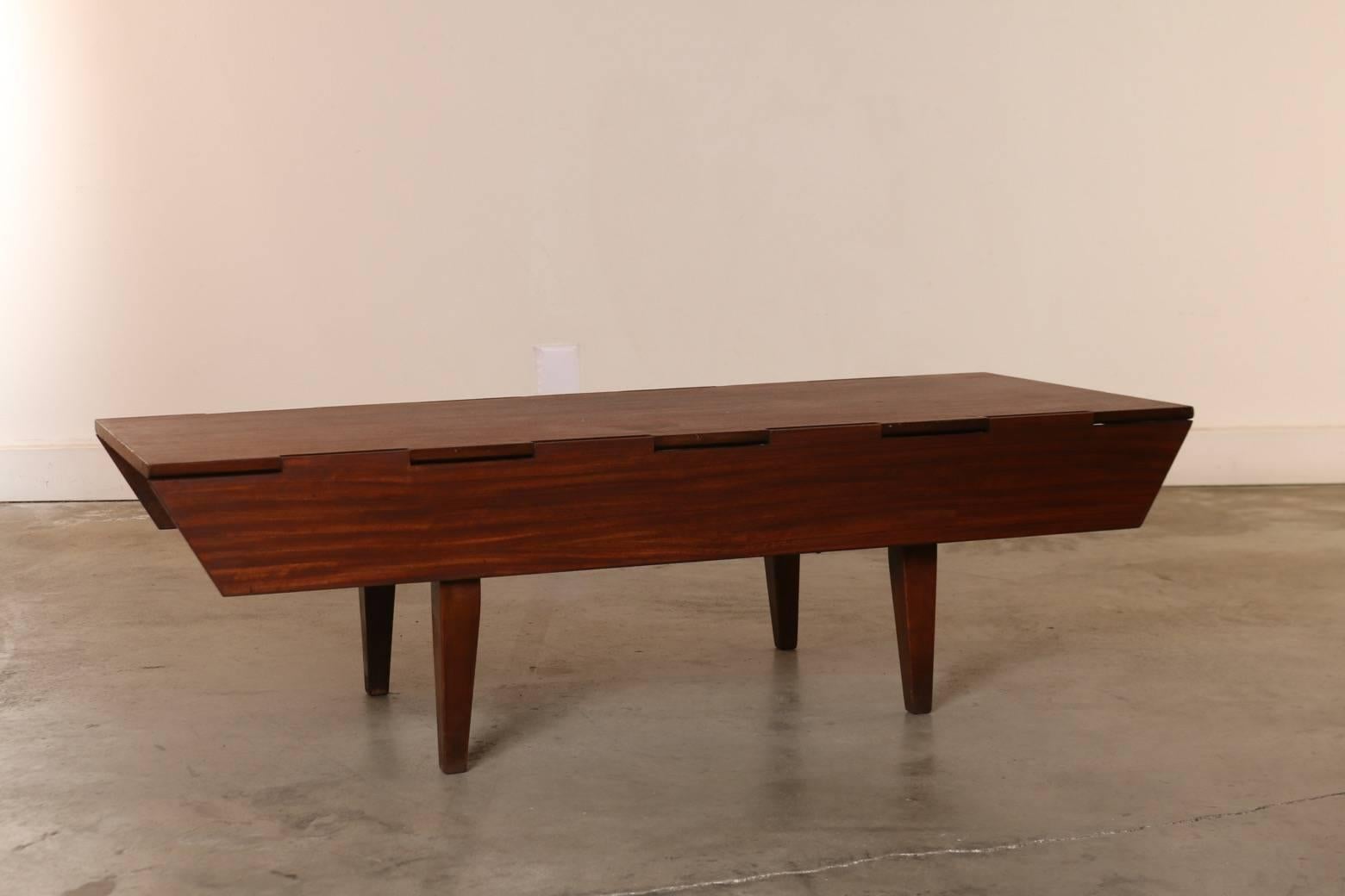 Convertible coffee table, dining table with fold down sides, by Milo Baughman for Drexel Perspective. Table dimensions 60 inches long x 39 inches wide (27 inches wide with side extensions down). A wonderful design lovers talking point and fully