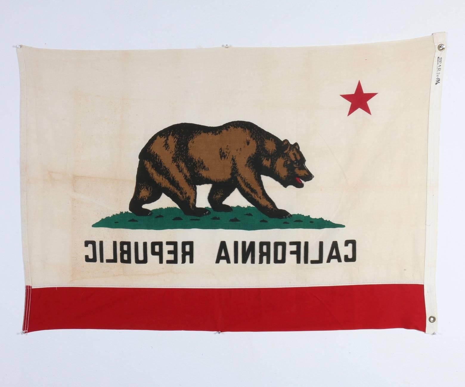 This is the original vintage cotton California flag measure 3 x 4.5 feet that you've been waiting for. Colors are still bright and vibrant, yet the flag exhibits wonderful patina and authentic aging.

Folds for shipping.