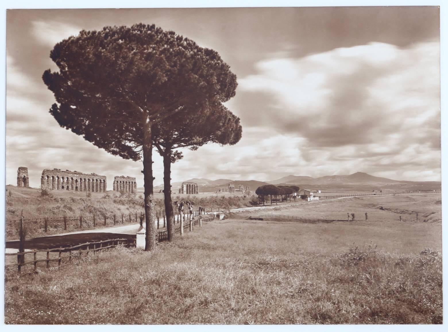 Sepia toned landscape photograph of a Roman Aqueduct, Acueducto Romano, in the Lazio countryside of Italy. This aqueduct directed water to Rome. This original photograph is in excellent condition with sepia tones exhibiting excellent contrast and